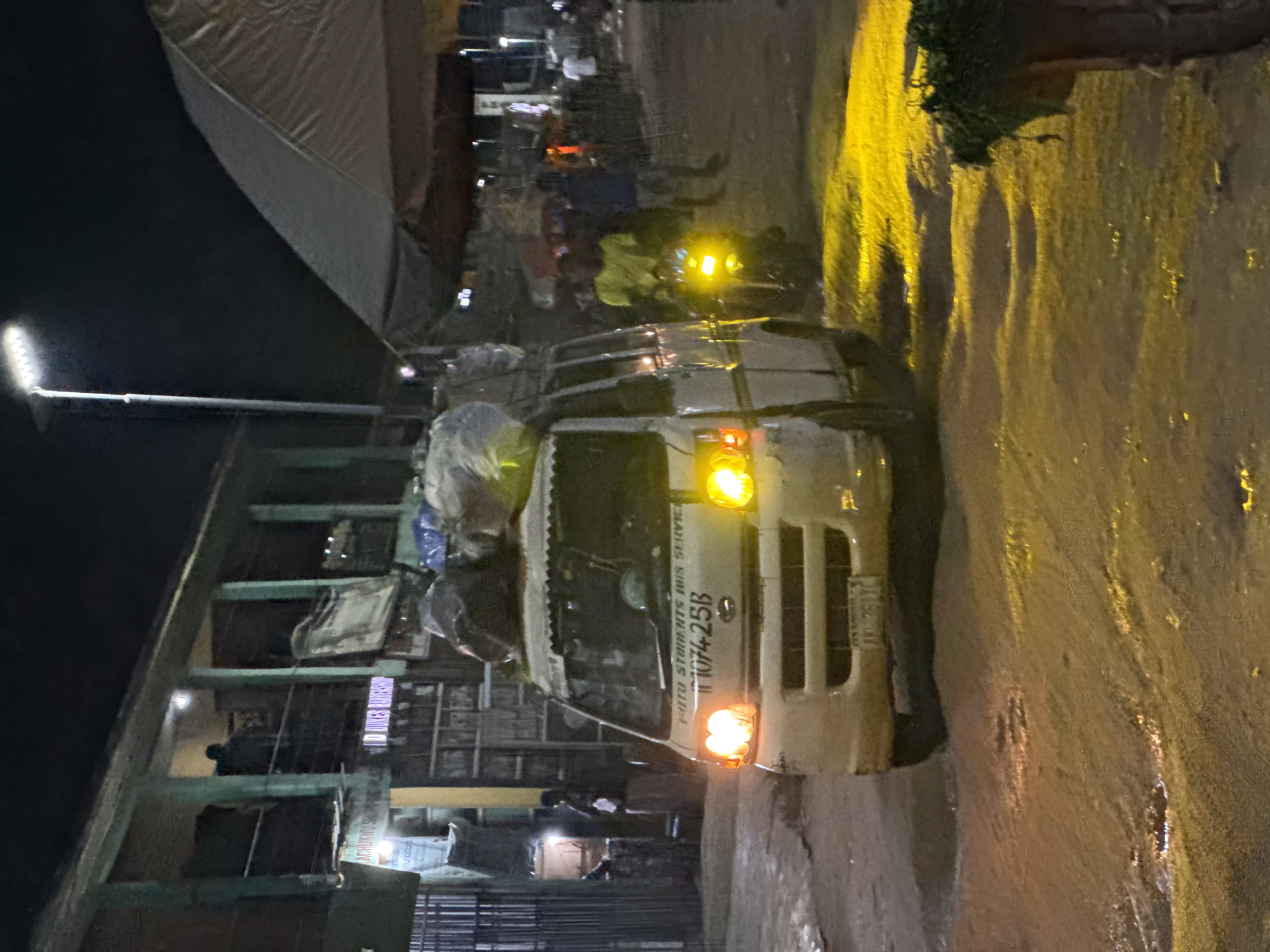 Night activity in Ihiagwa — transport, traffic, and fresh produce
