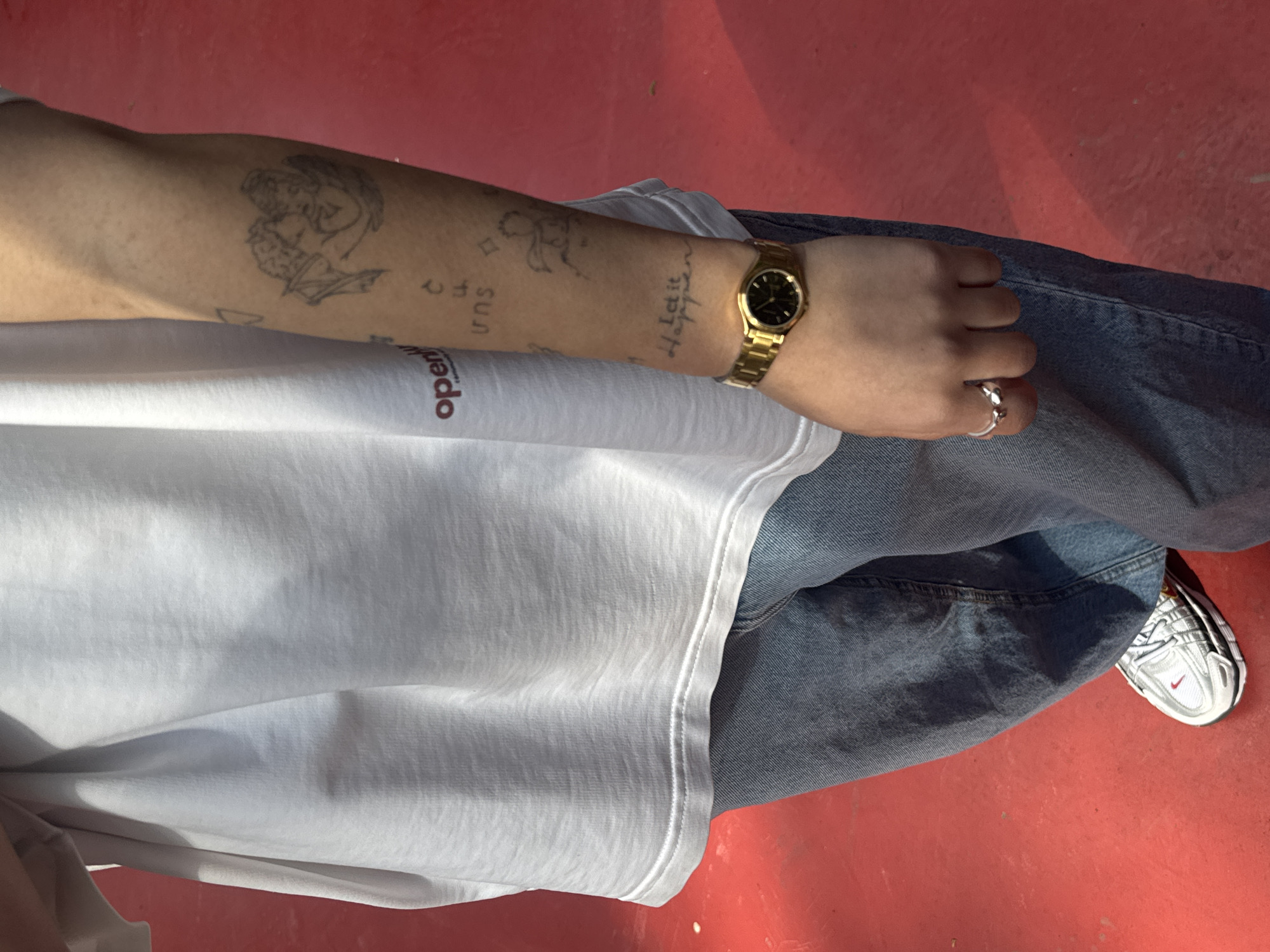 Tattooed individual in casual wear photographed in Yerevan