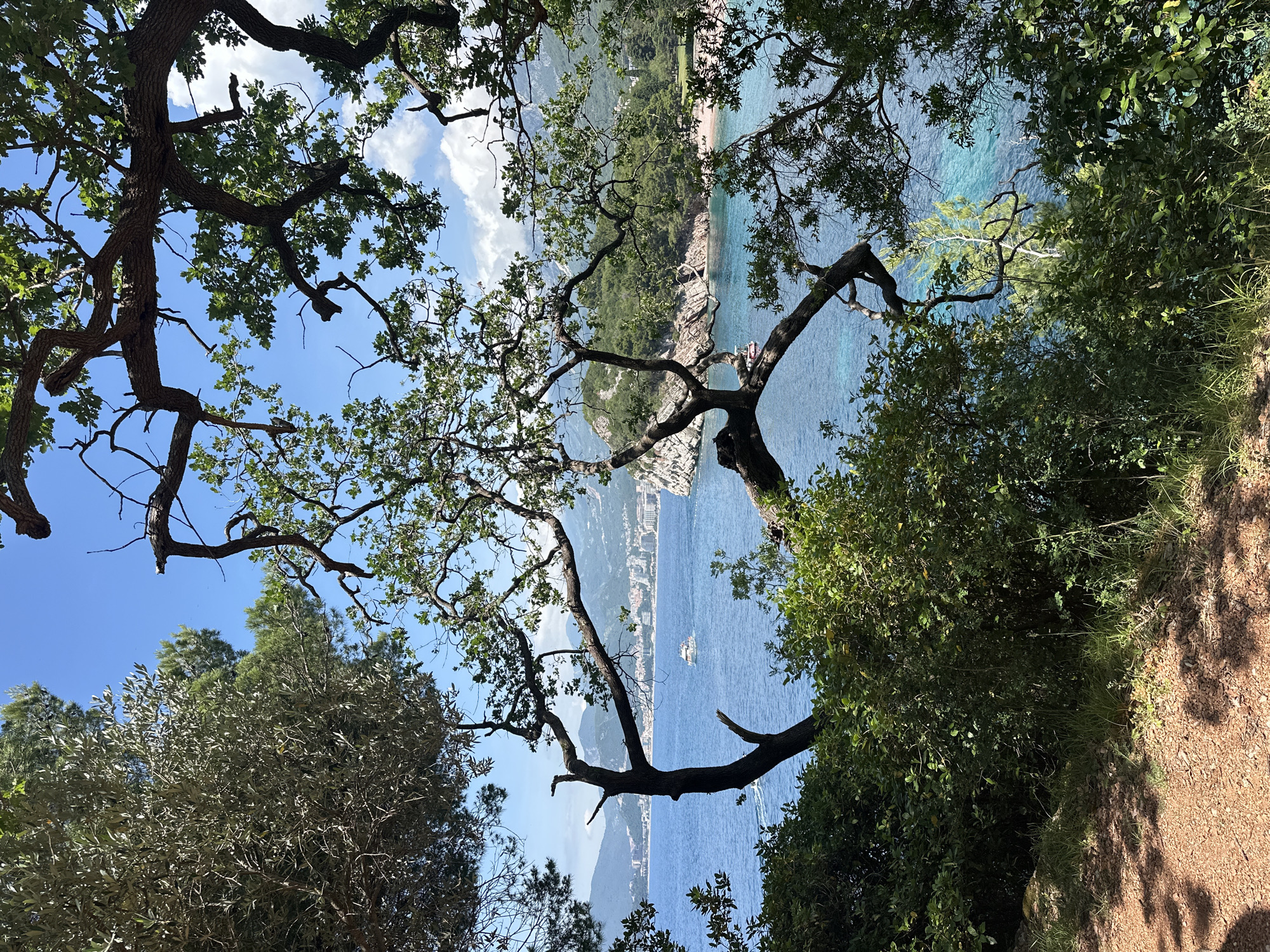 Tourist moments captured at Montenegro's Sveti Stefan coastal resort