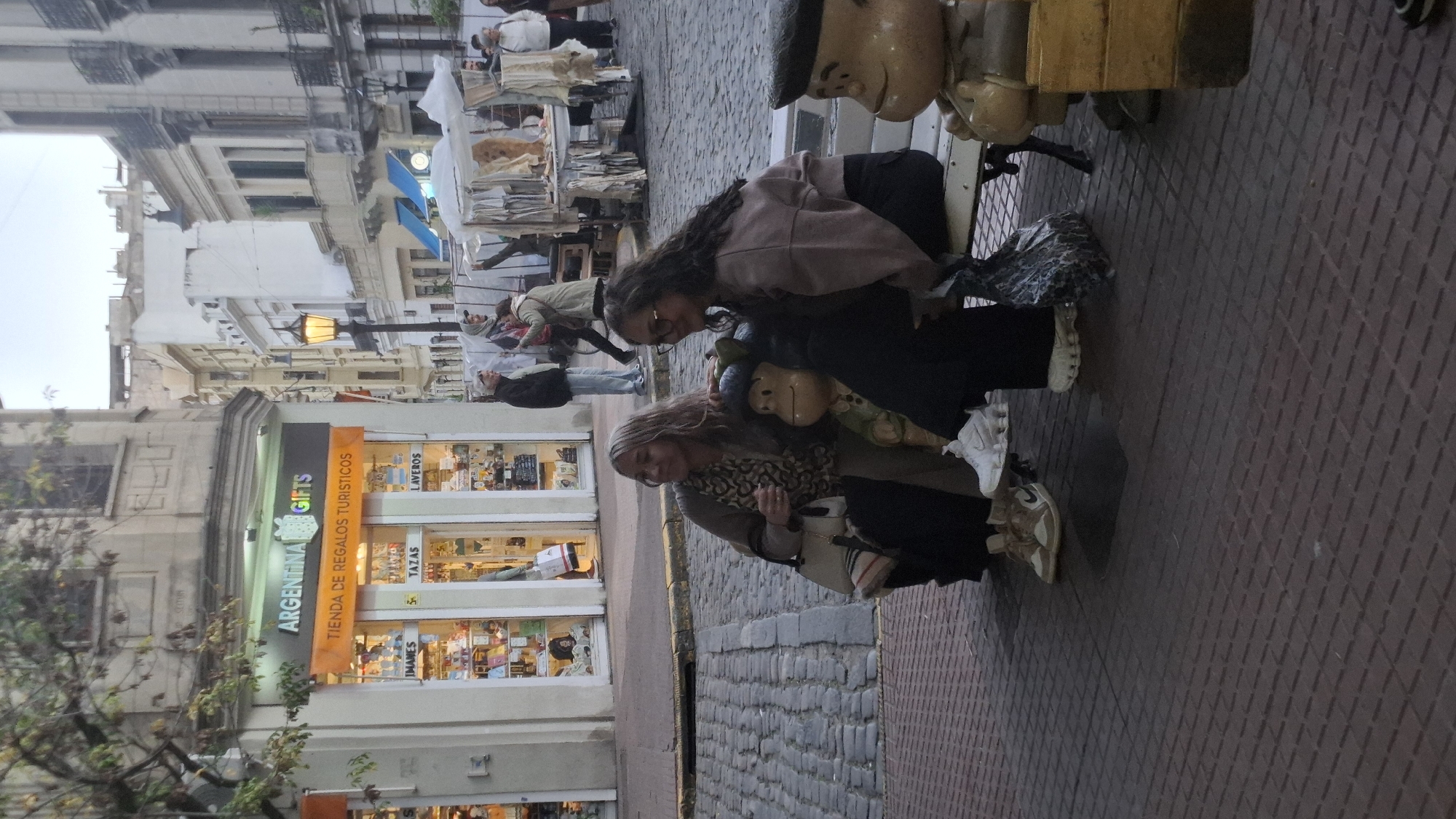 Evening street market and tourist activity captured in Buenos Aires
