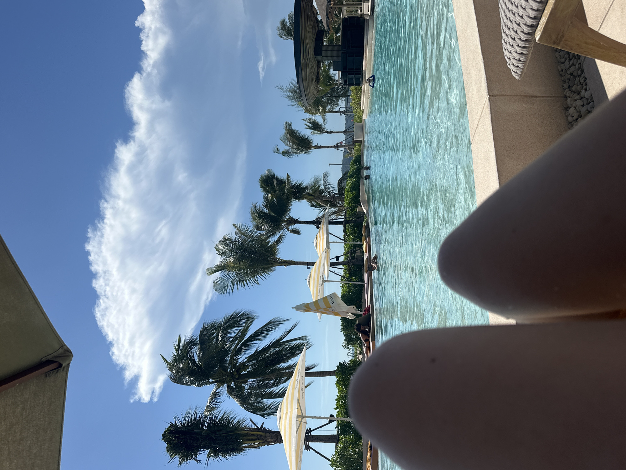 Resort poolside leisure activities documented during morning hours