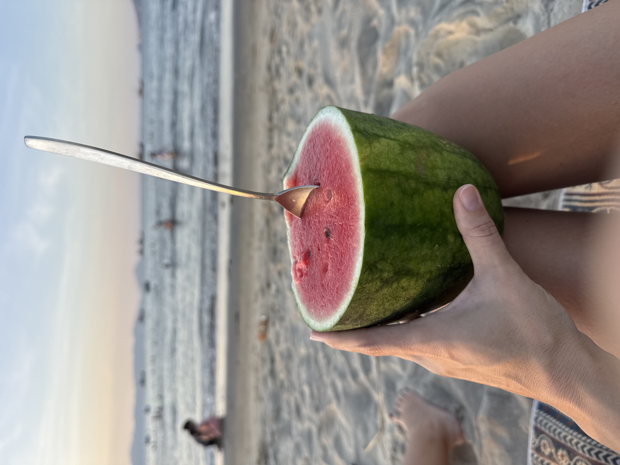 Watermelon on the sand, sunset over Da Nang beach