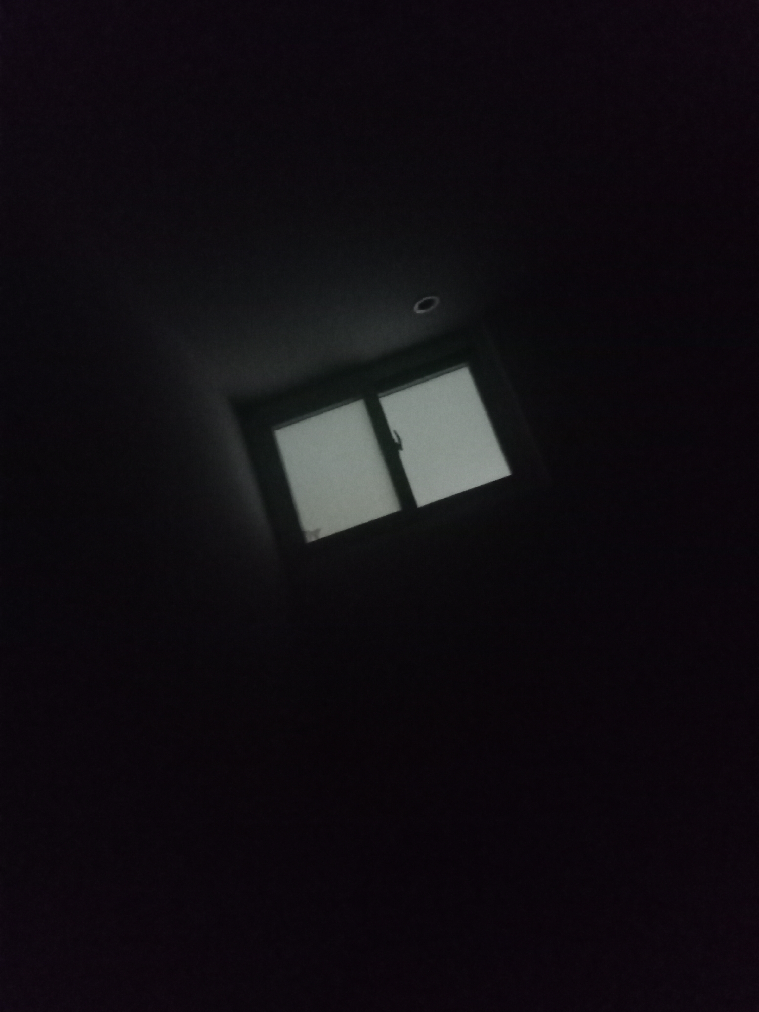 Dimly lit room and device screen captured in nighttime memories