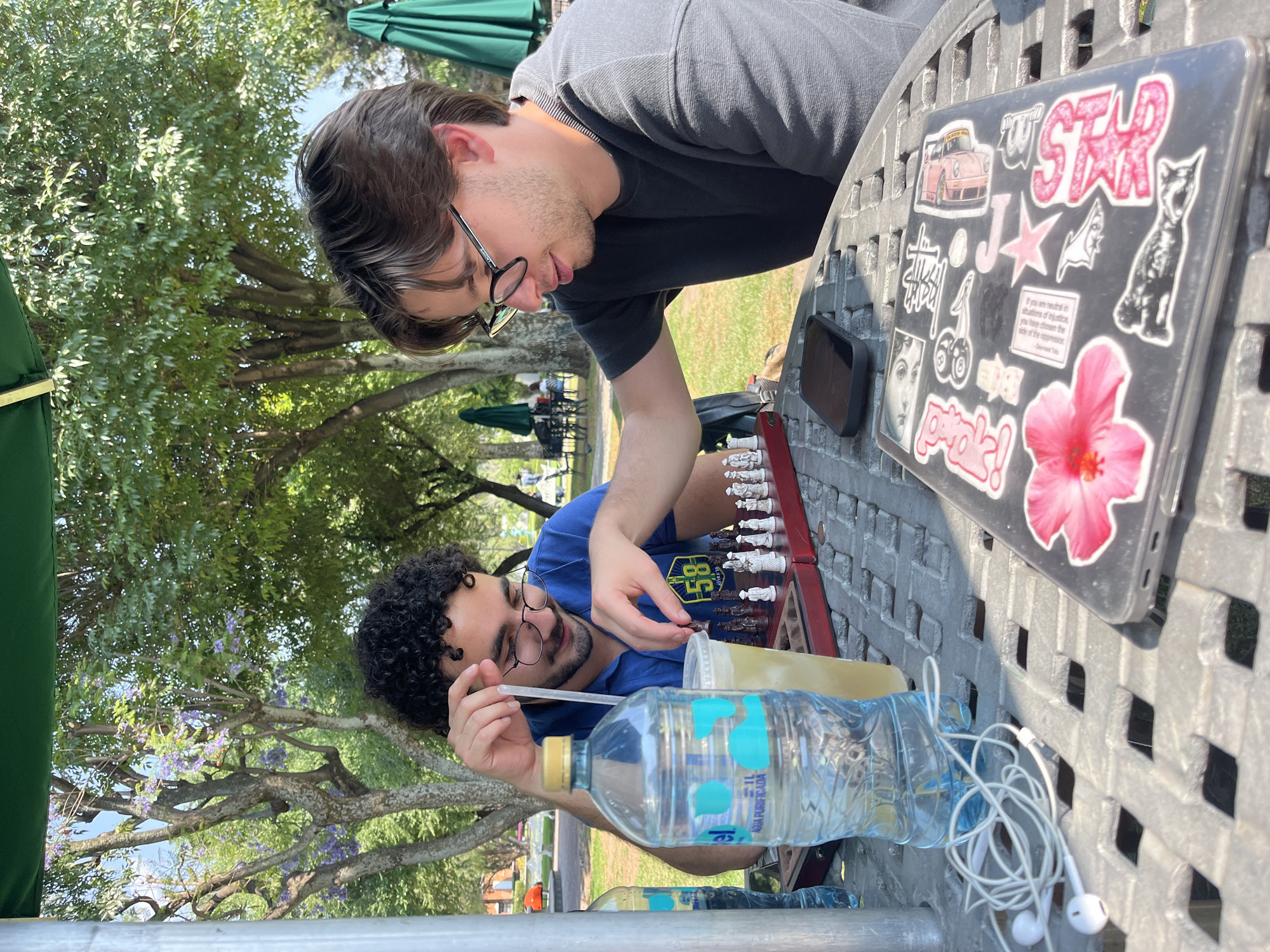 Two men play chess outdoors in San Andrés Cholula