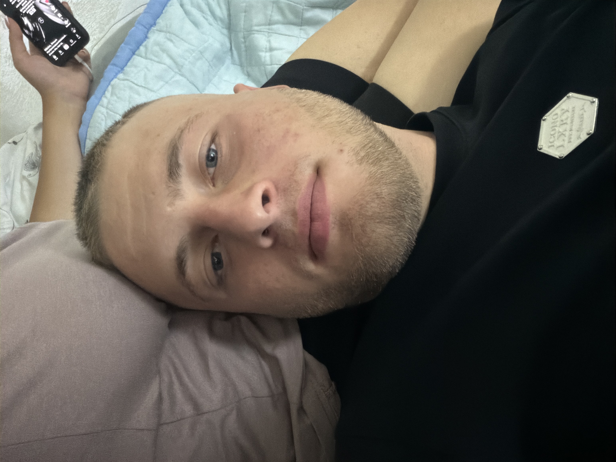 Quiet, intimate moment shared in a Moldovan bedroom
