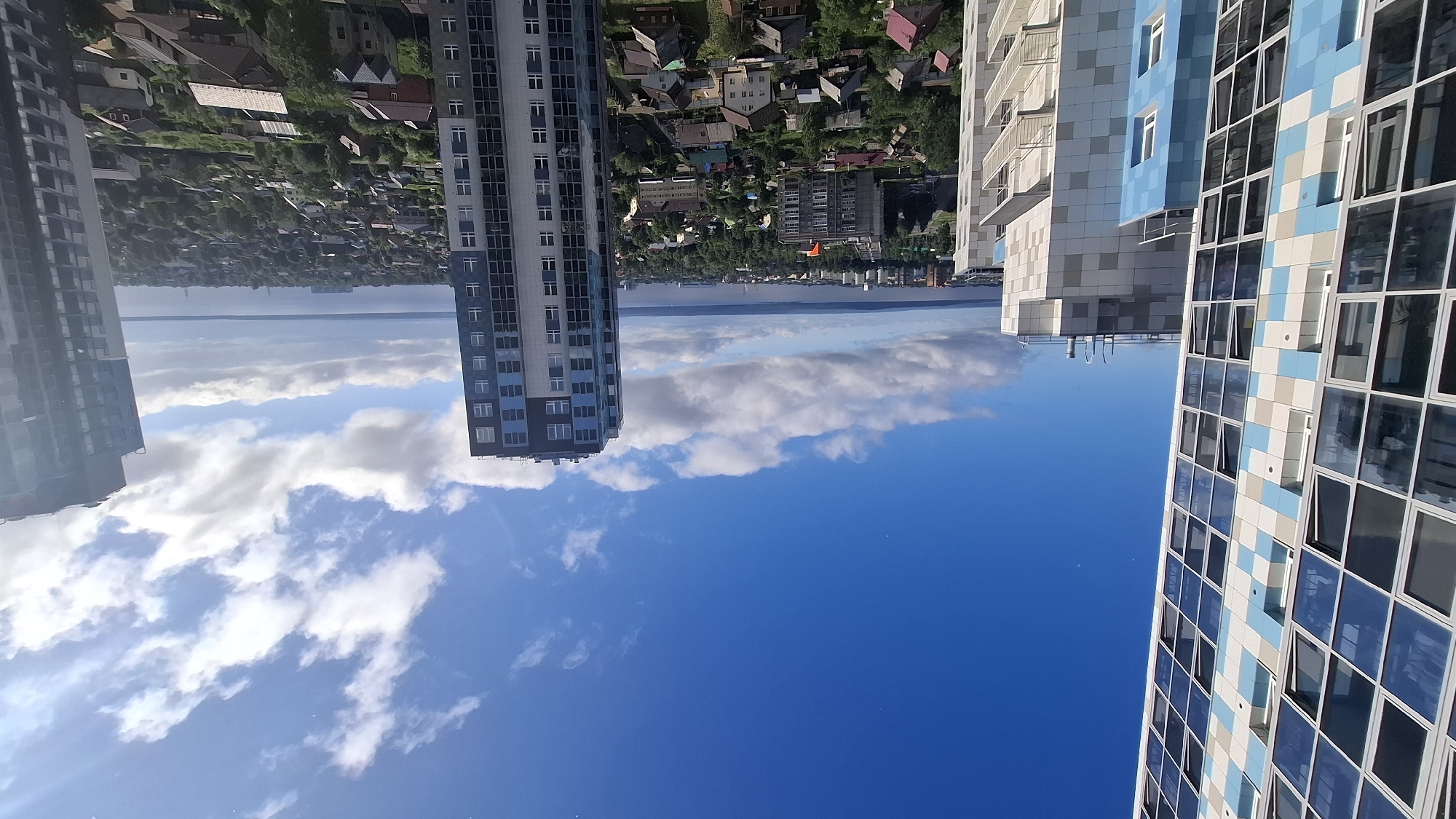 Aerial sweep over Petrozavodsk's mix of housing and high-rises
