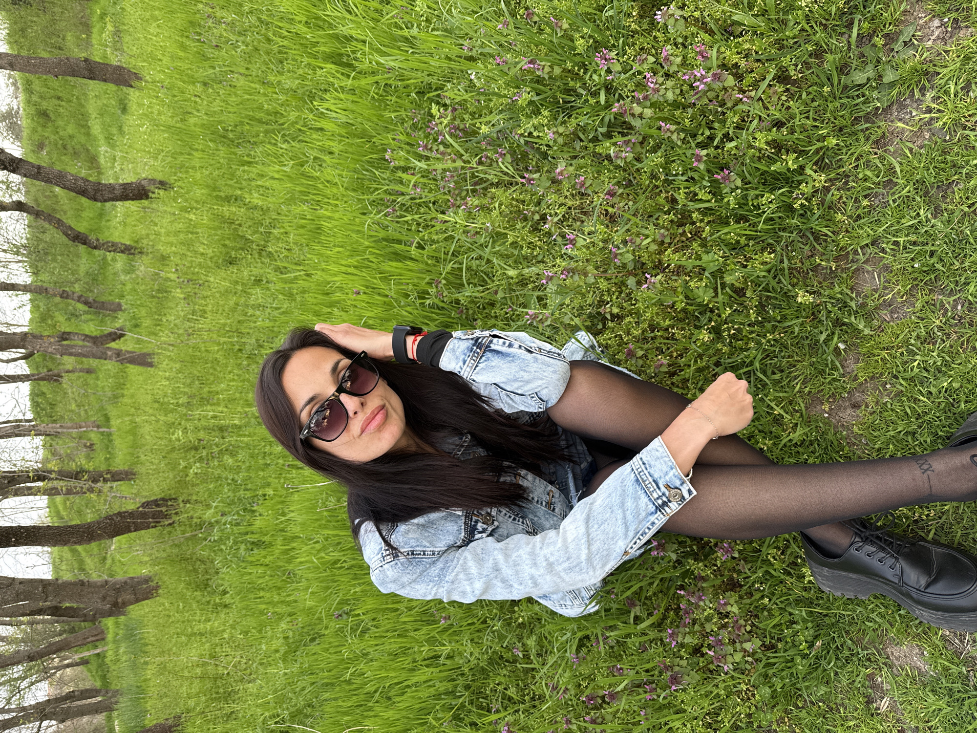 Woman photographed with flower bouquet in Pleven park setting