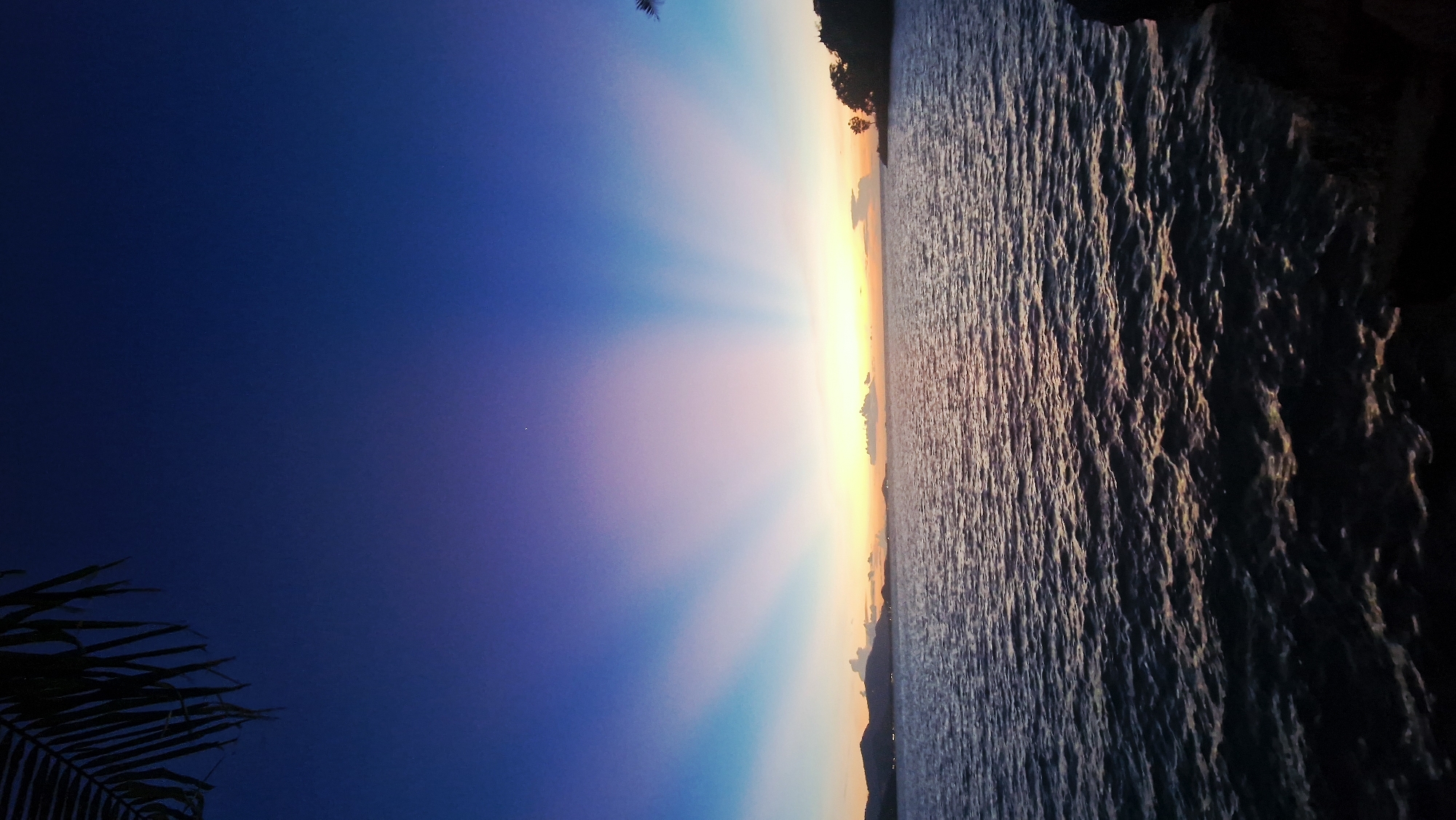 Rocky coastline sunset at Baan Plai Laem, Thailand