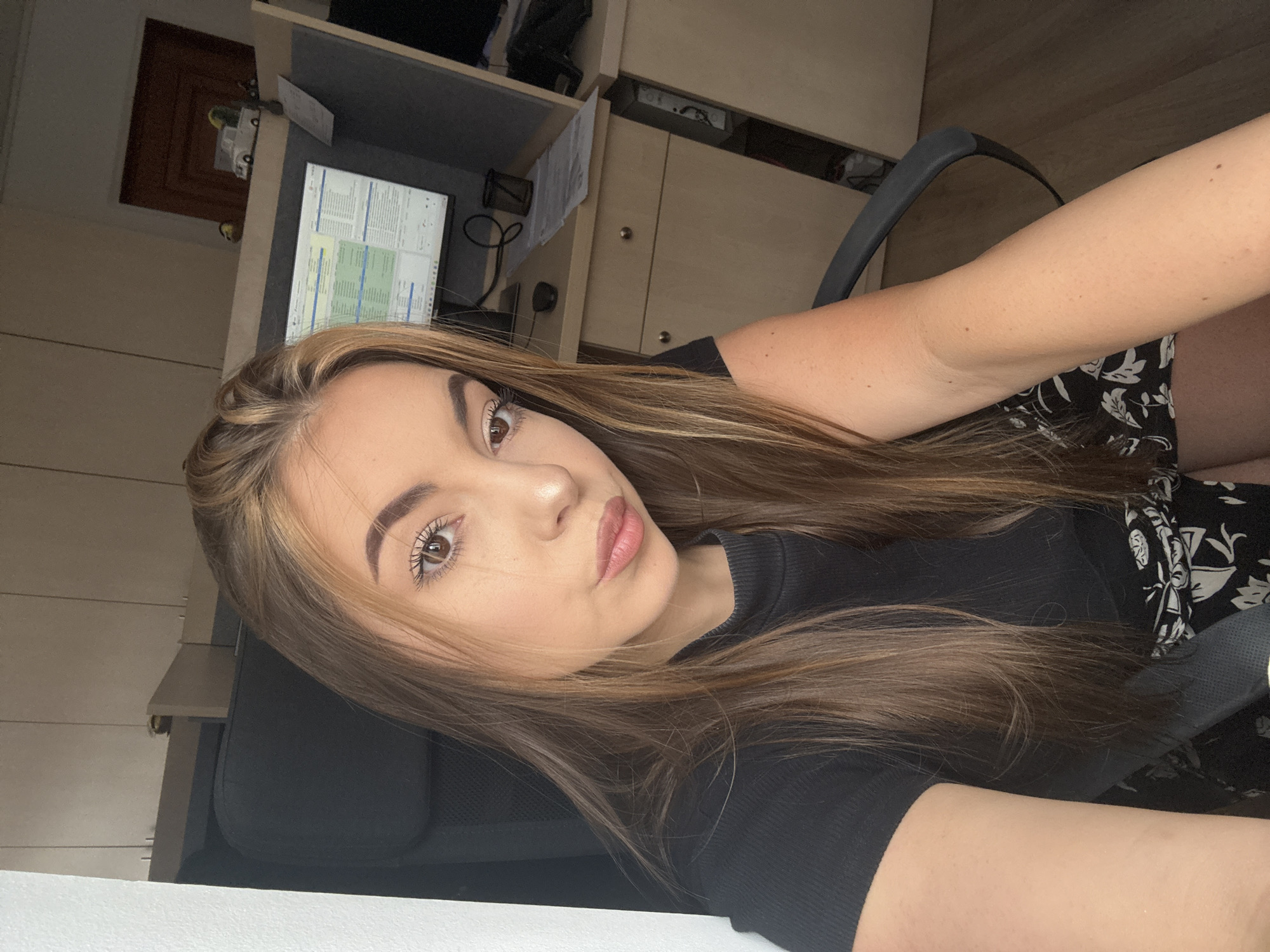 Woman documents office selfie session in Sofia