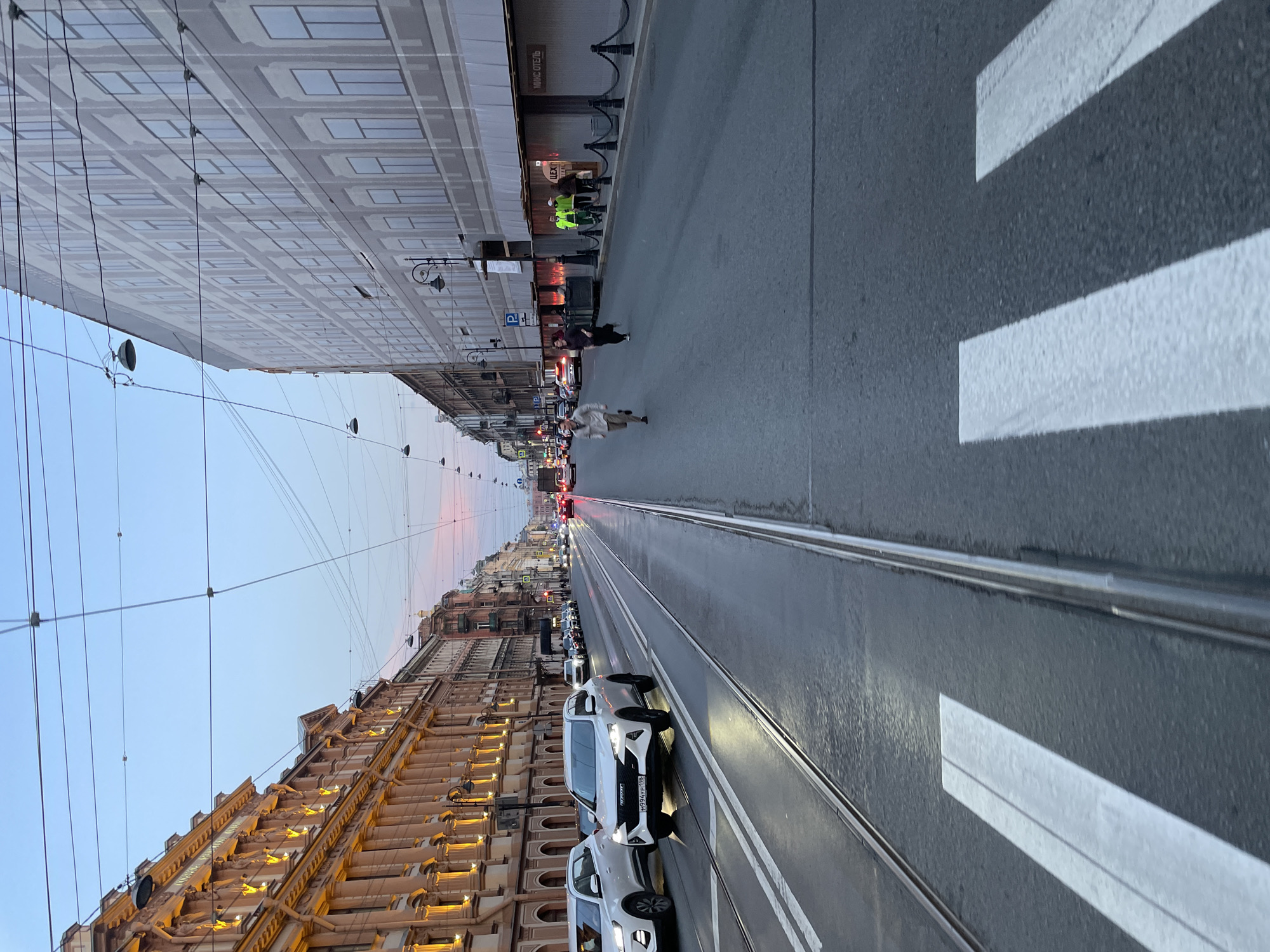 Evening street life documented across central Saint Petersburg