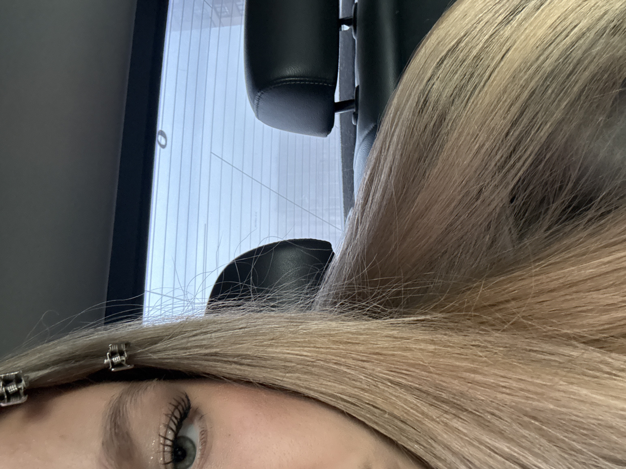 Close-up portrait captured in Saint Petersburg showing blonde hair styling