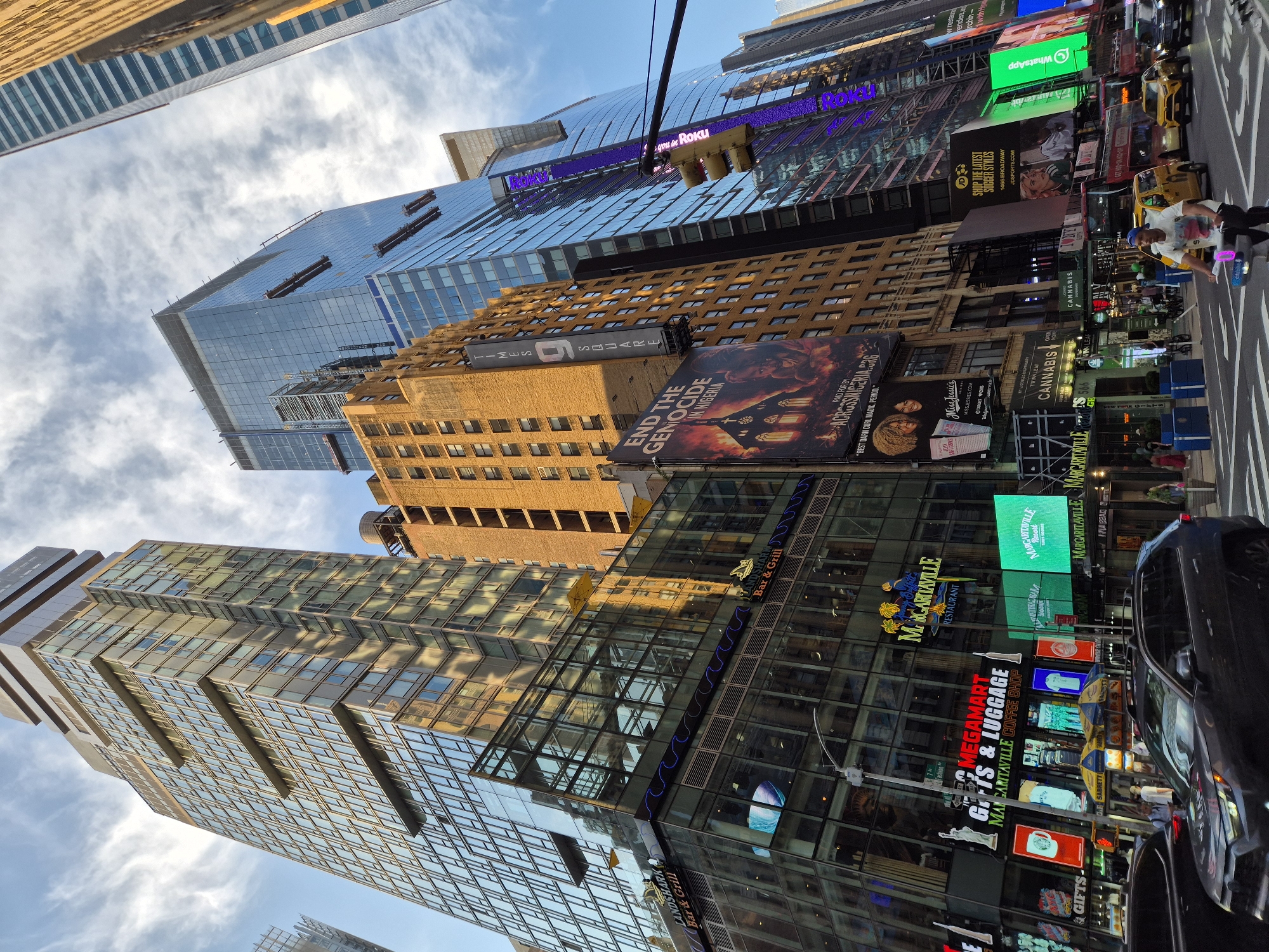 Street-level and sky-high views of Times Square at night