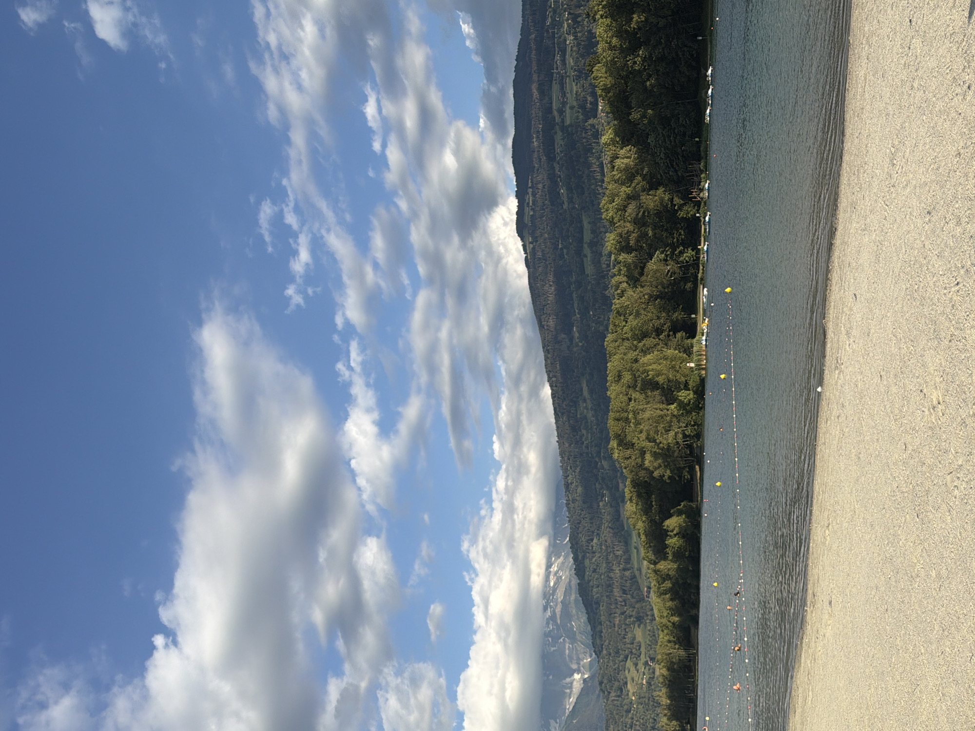 Calm summer afternoon at Lake Passy's sandy beach