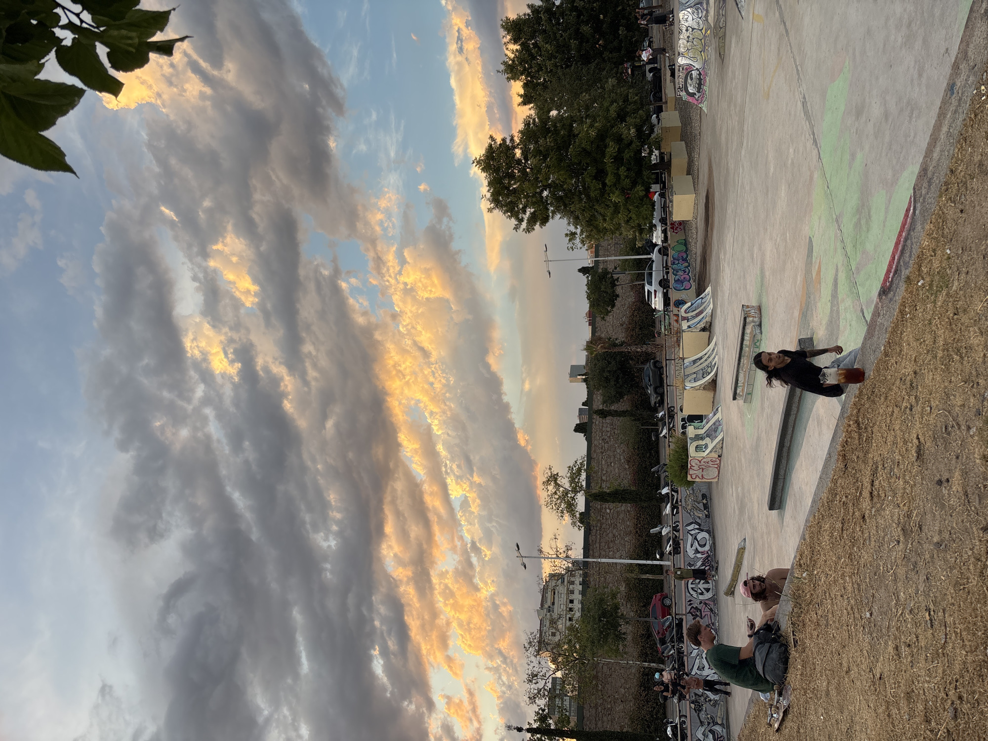 Barcelona skatepark glows under a golden August sunset