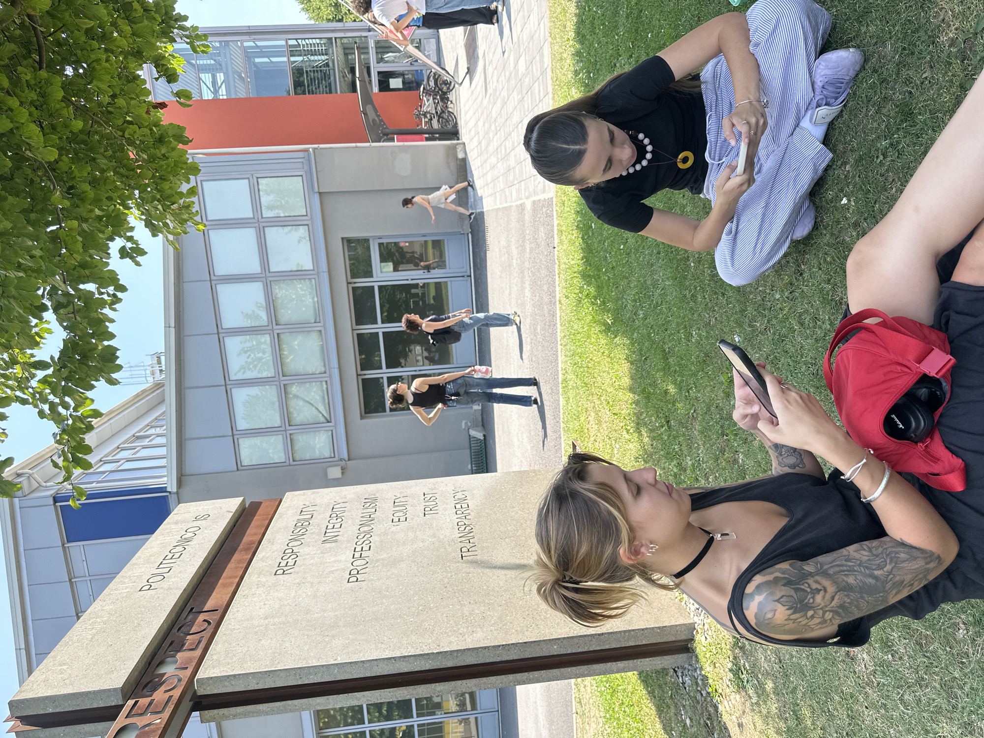 Sunny afternoon hangout on the grass at Politecnico di Milano