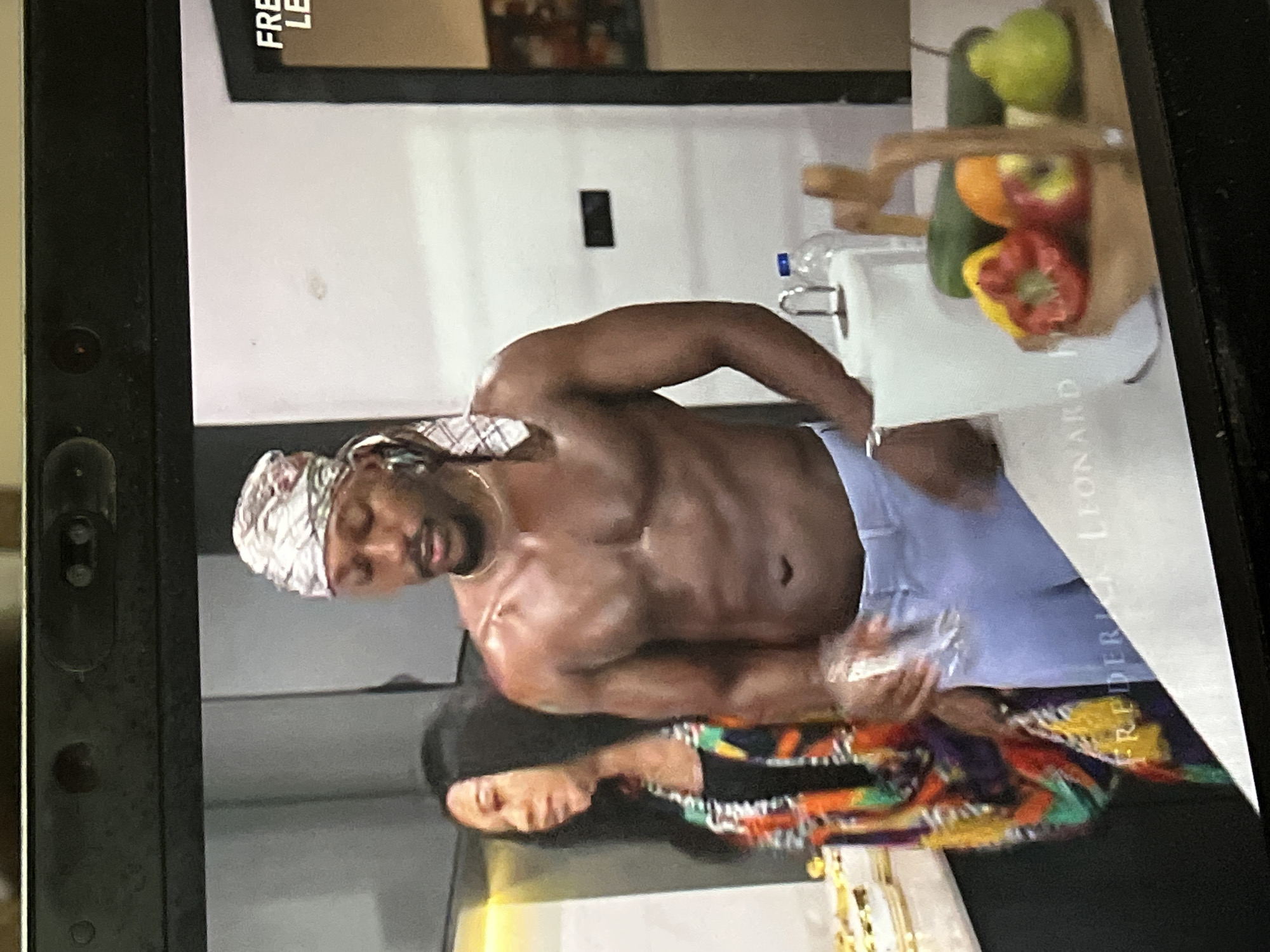 Man watches Nigerian film 'The Kinsman' on devices in Abuja