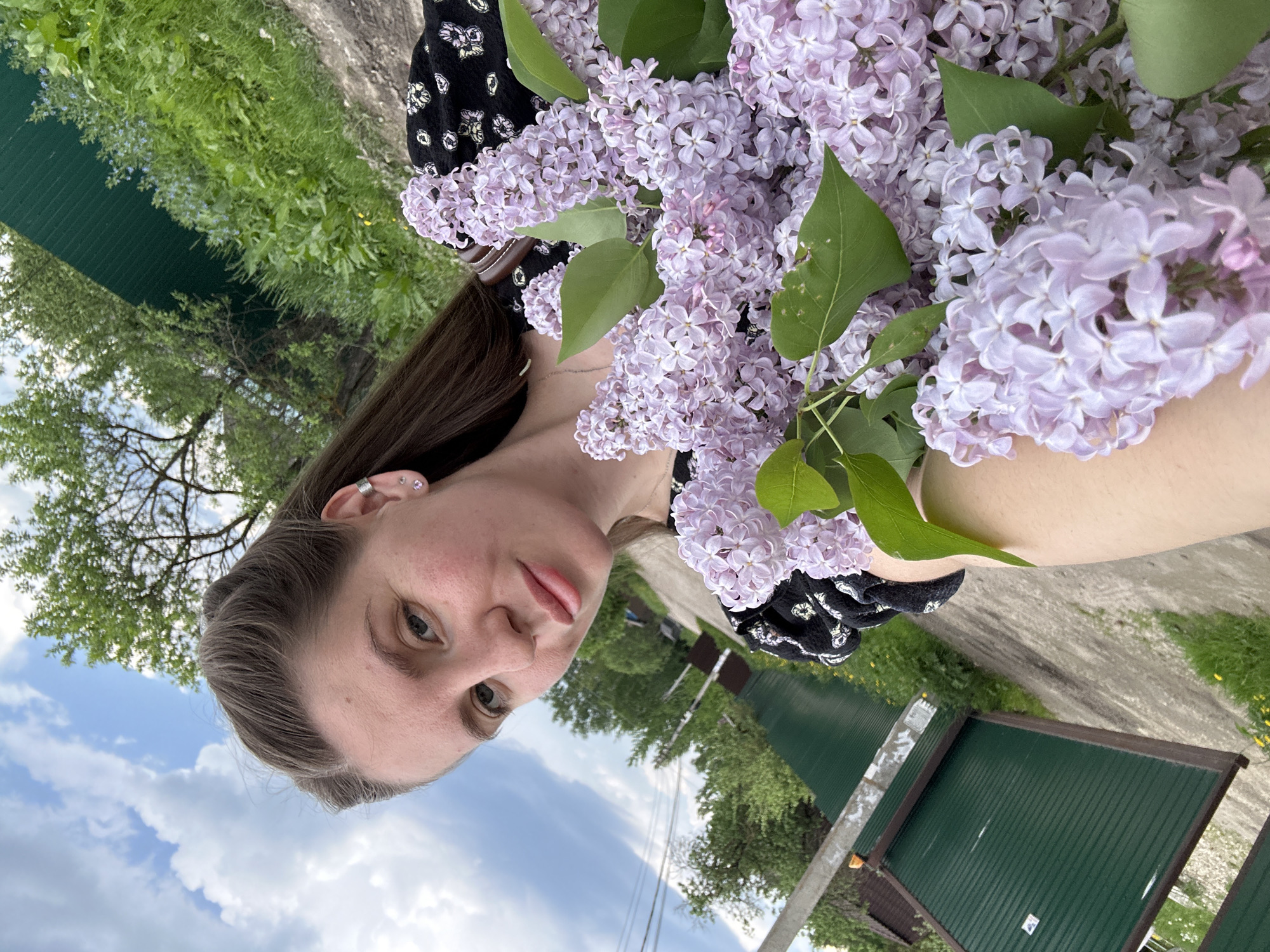 Woman enjoys quiet spring morning with flowers in Klin