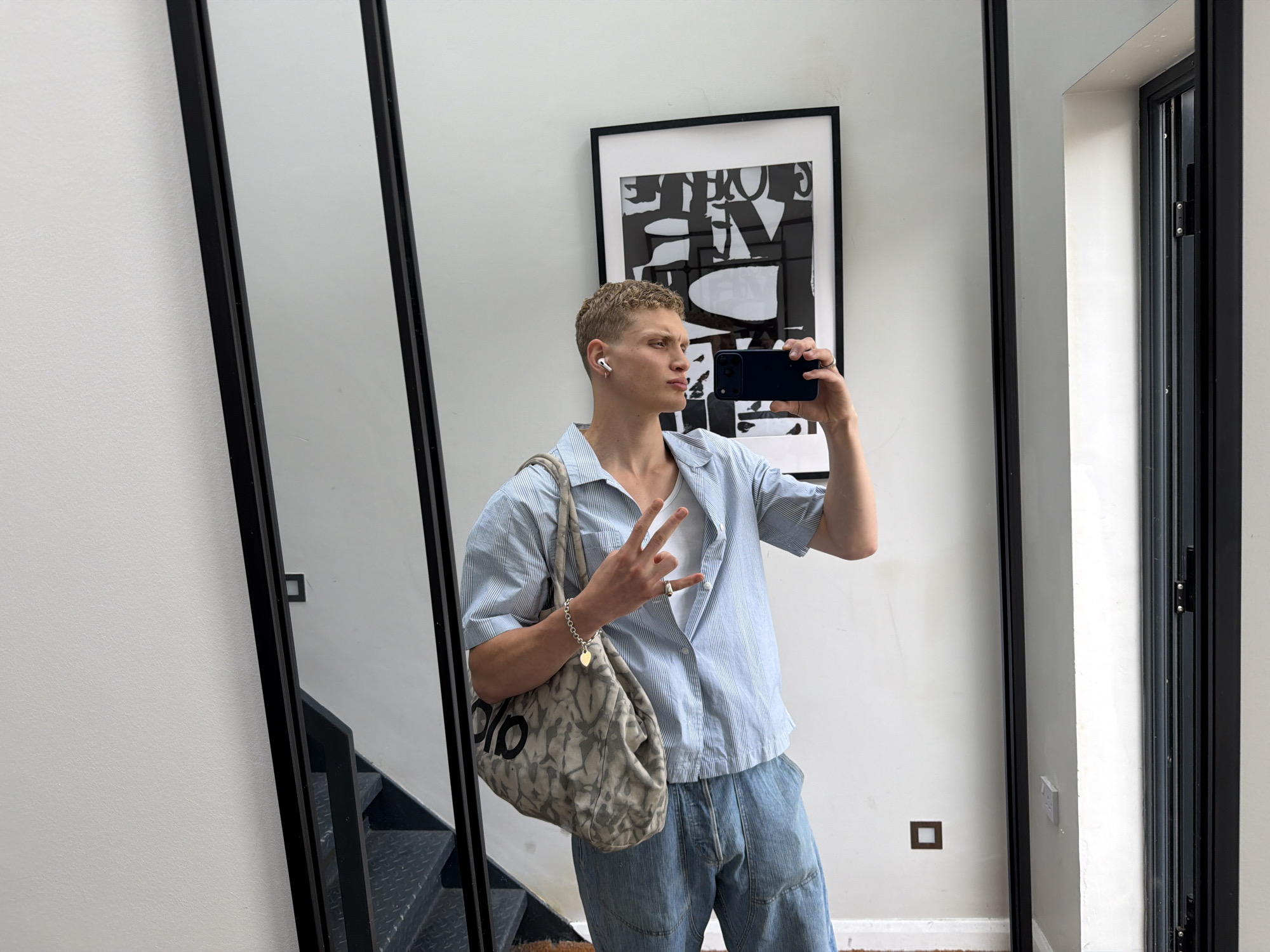 Mirror selfie in modern London interior space
