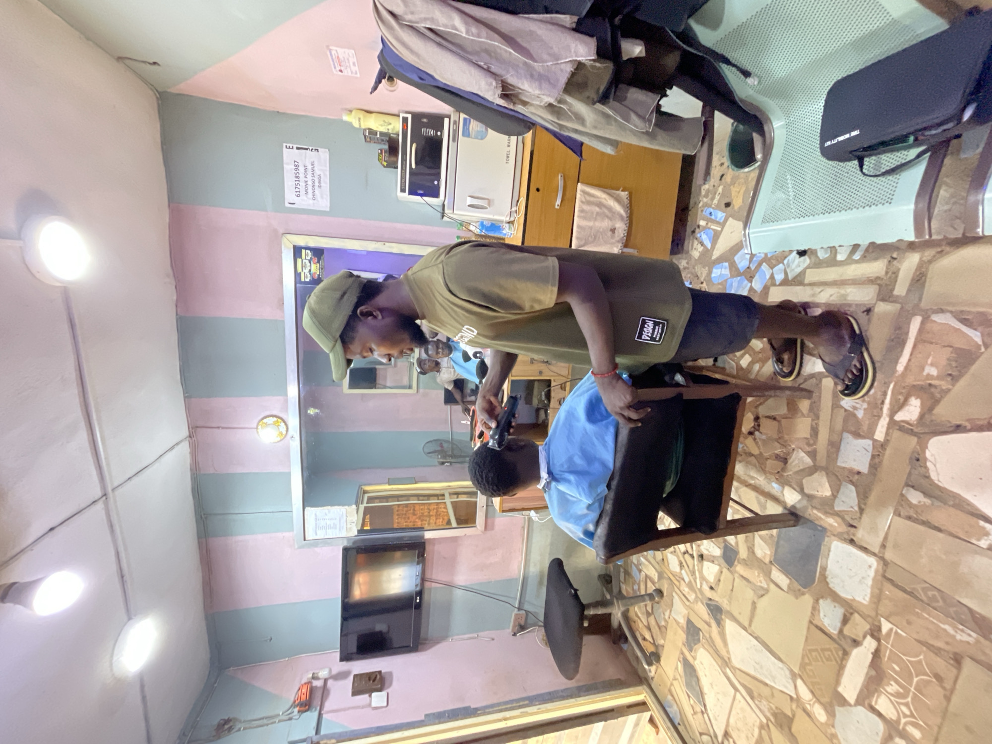 Routine haircut service documented at Onitsha barbershop