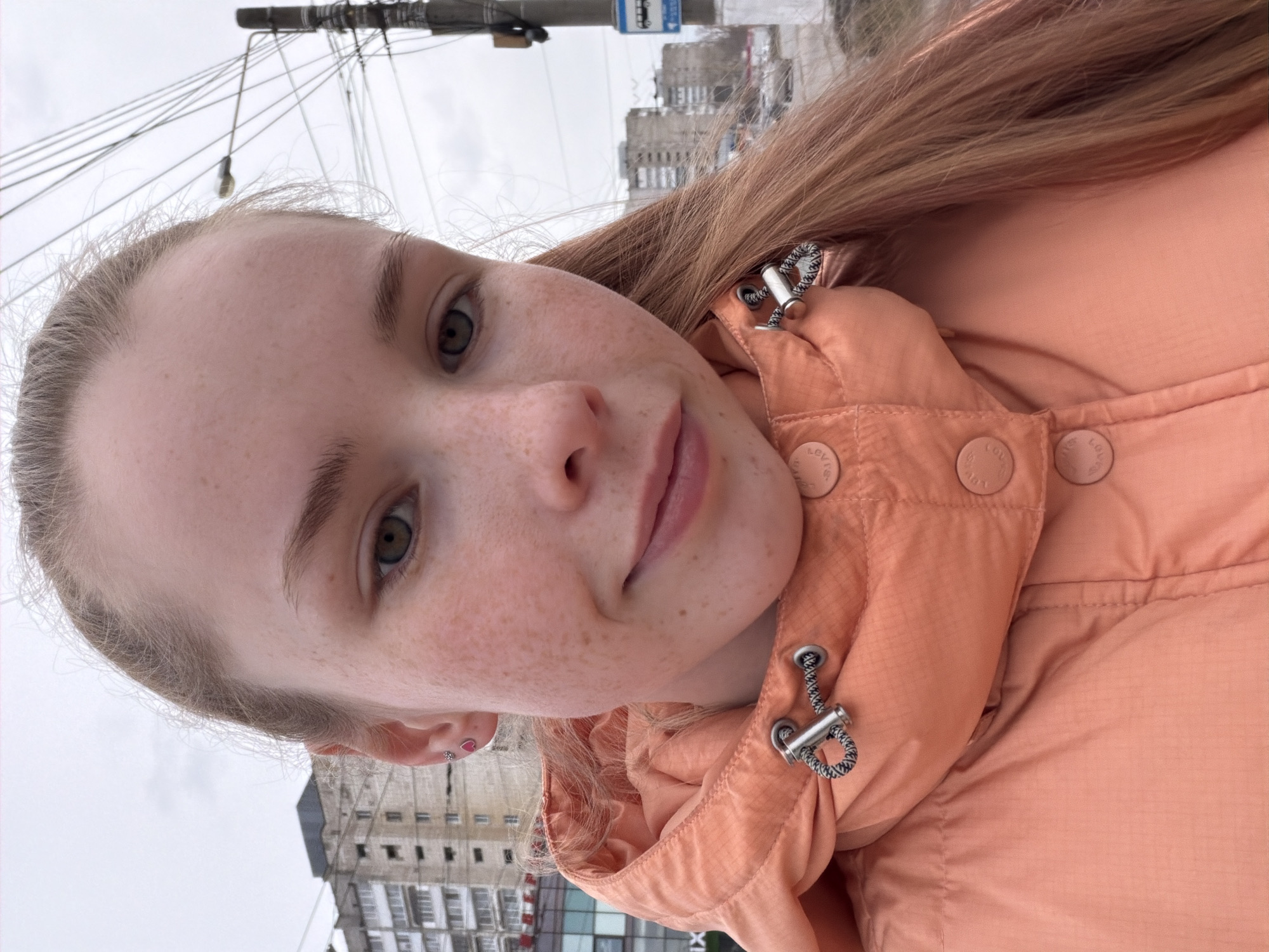 Woman takes selfies in Levi's jacket on Berezniki street