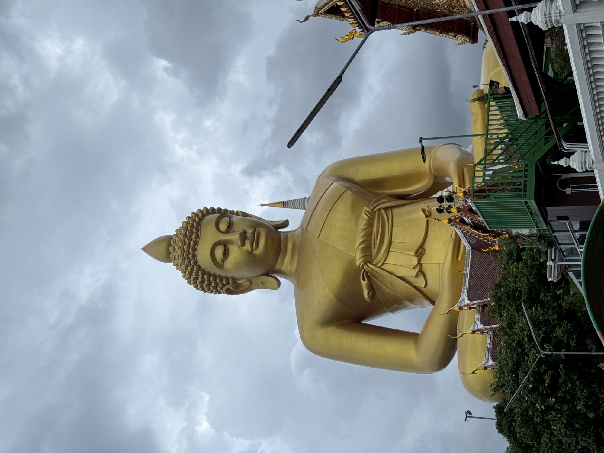 Bangkok's Wat Paknam golden Buddha, seen from land and canal