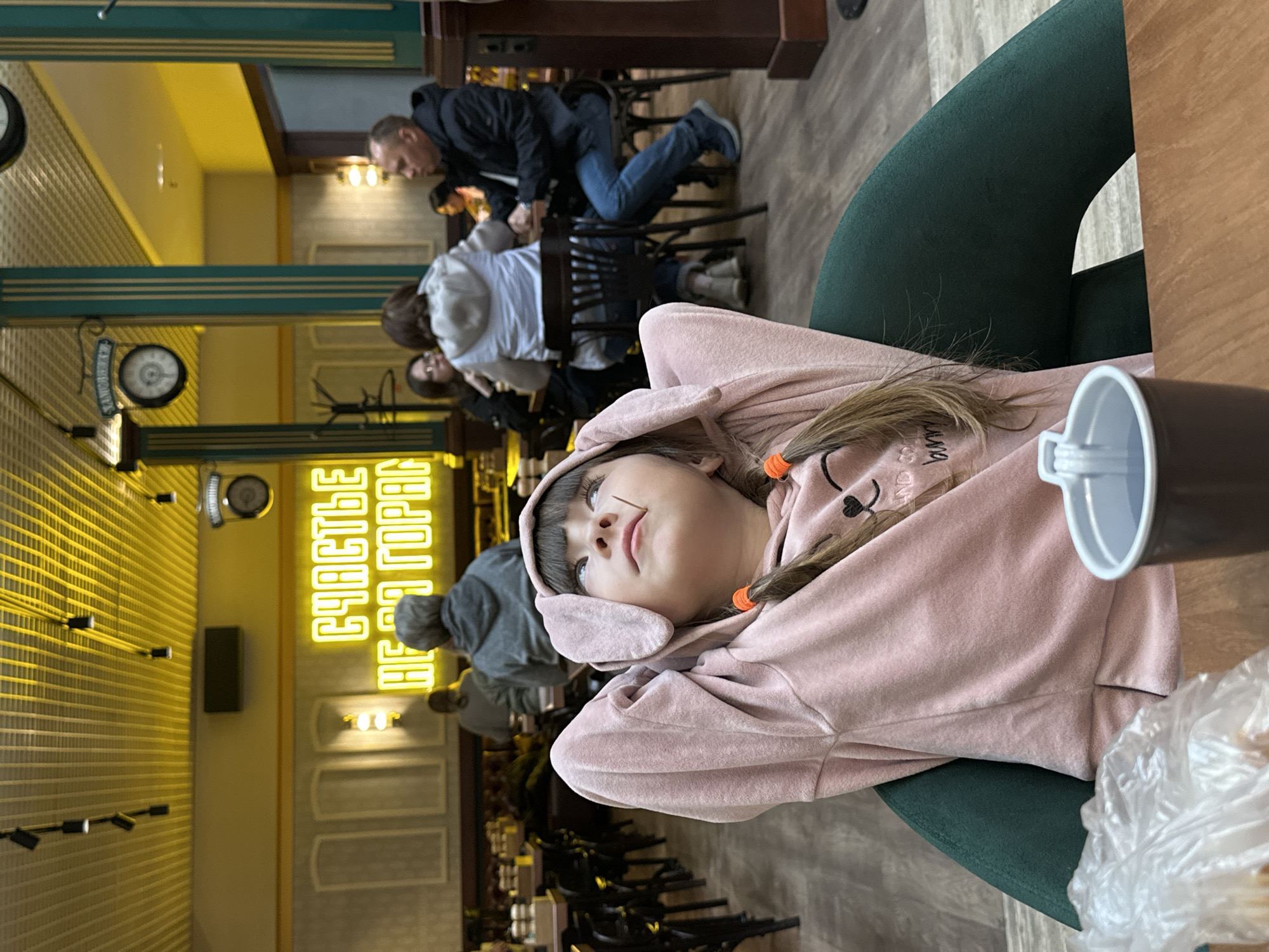 Child in pink bunny hoodie observed at Bolshoye Savino venue