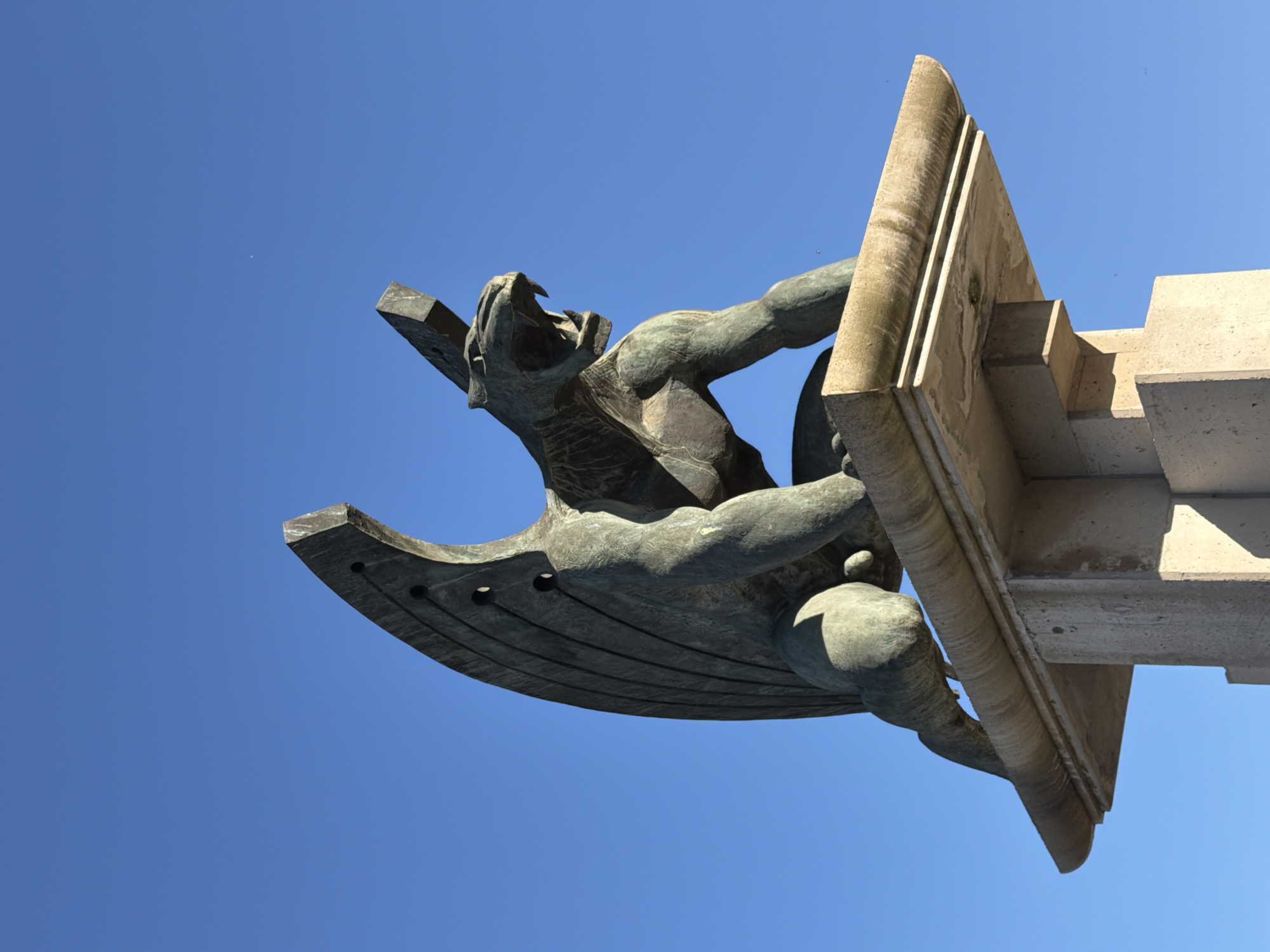 Winged bronze figure sculpture spotted on Valencia stone structure