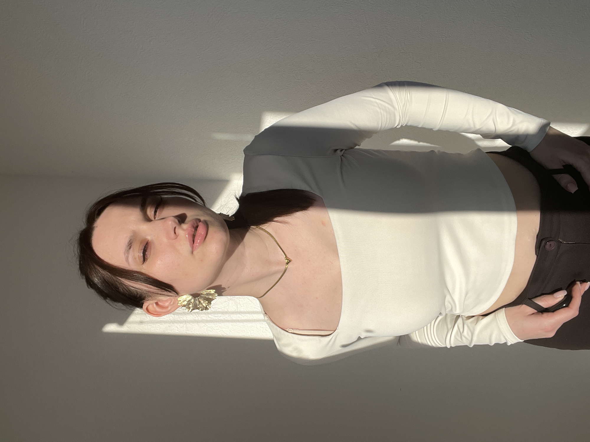 Woman photographed in multiple poses indoors in Tyumen