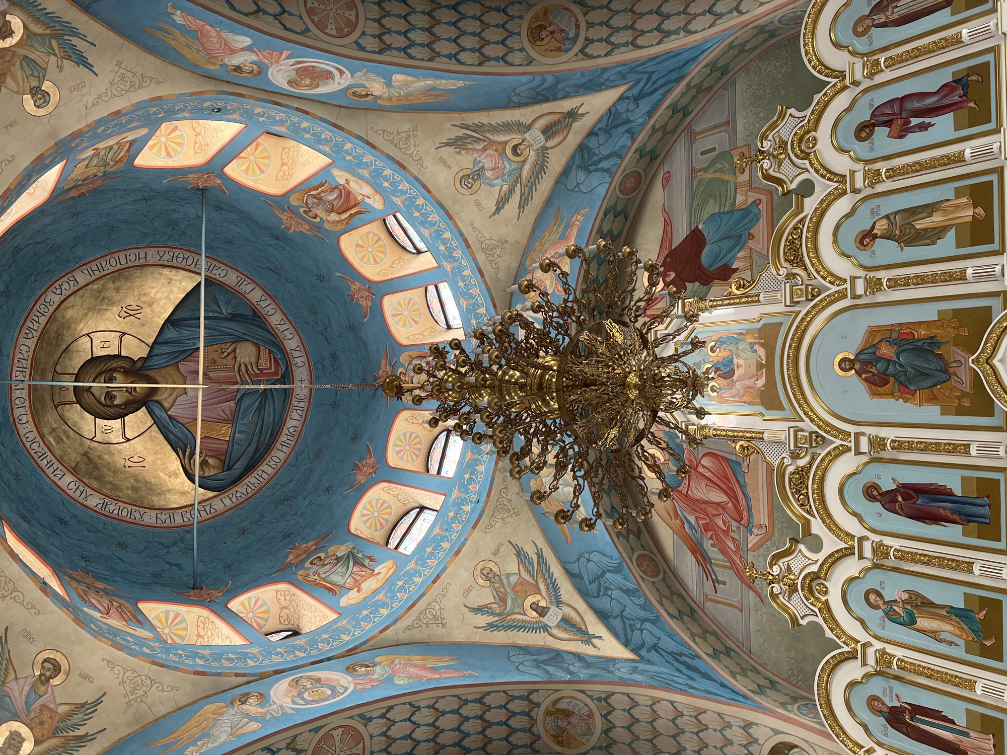 Visitor documents historic Russian Orthodox church in Kargapolye