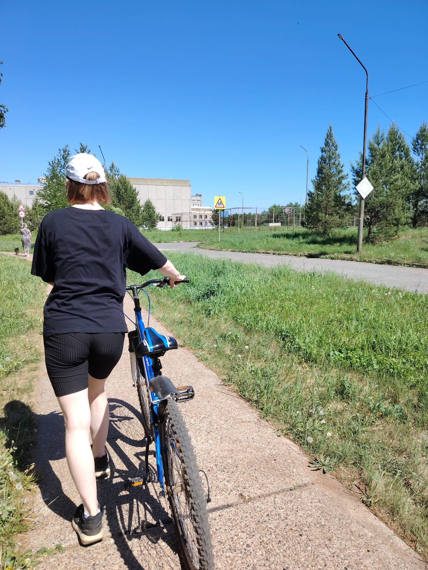 Morning scenes captured in Марковский: cyclist and two women