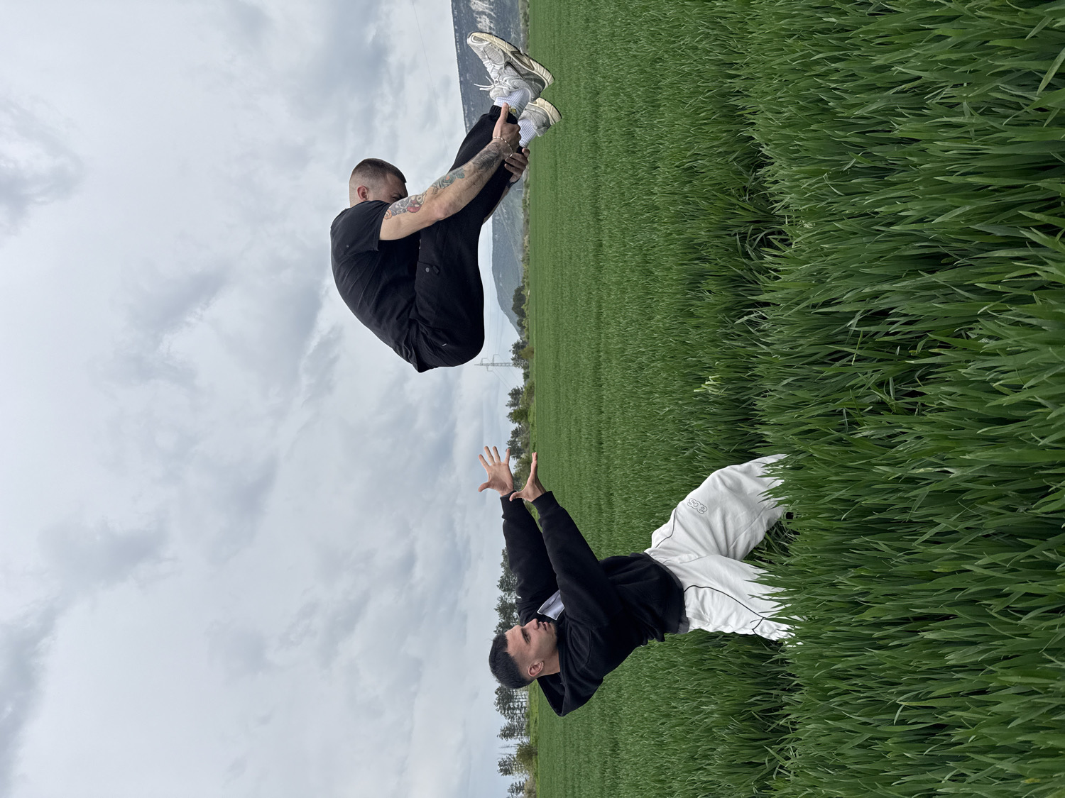 Men practice acrobatics in Bulgarian field