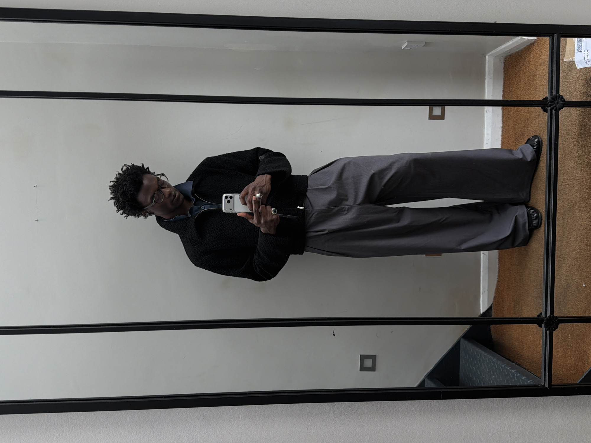 Man takes selfie in front of mirror in London