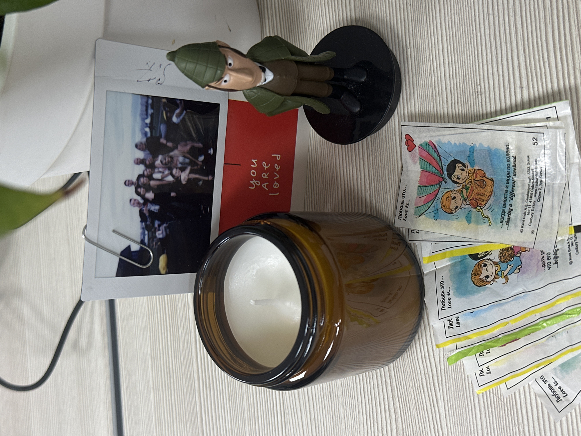 Personal items with photograph documented on wooden surface in Kazan