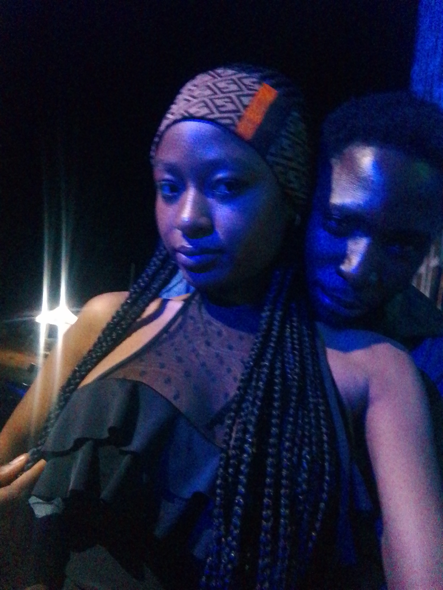 Late-night hangout at a blue-lit club or bar venue