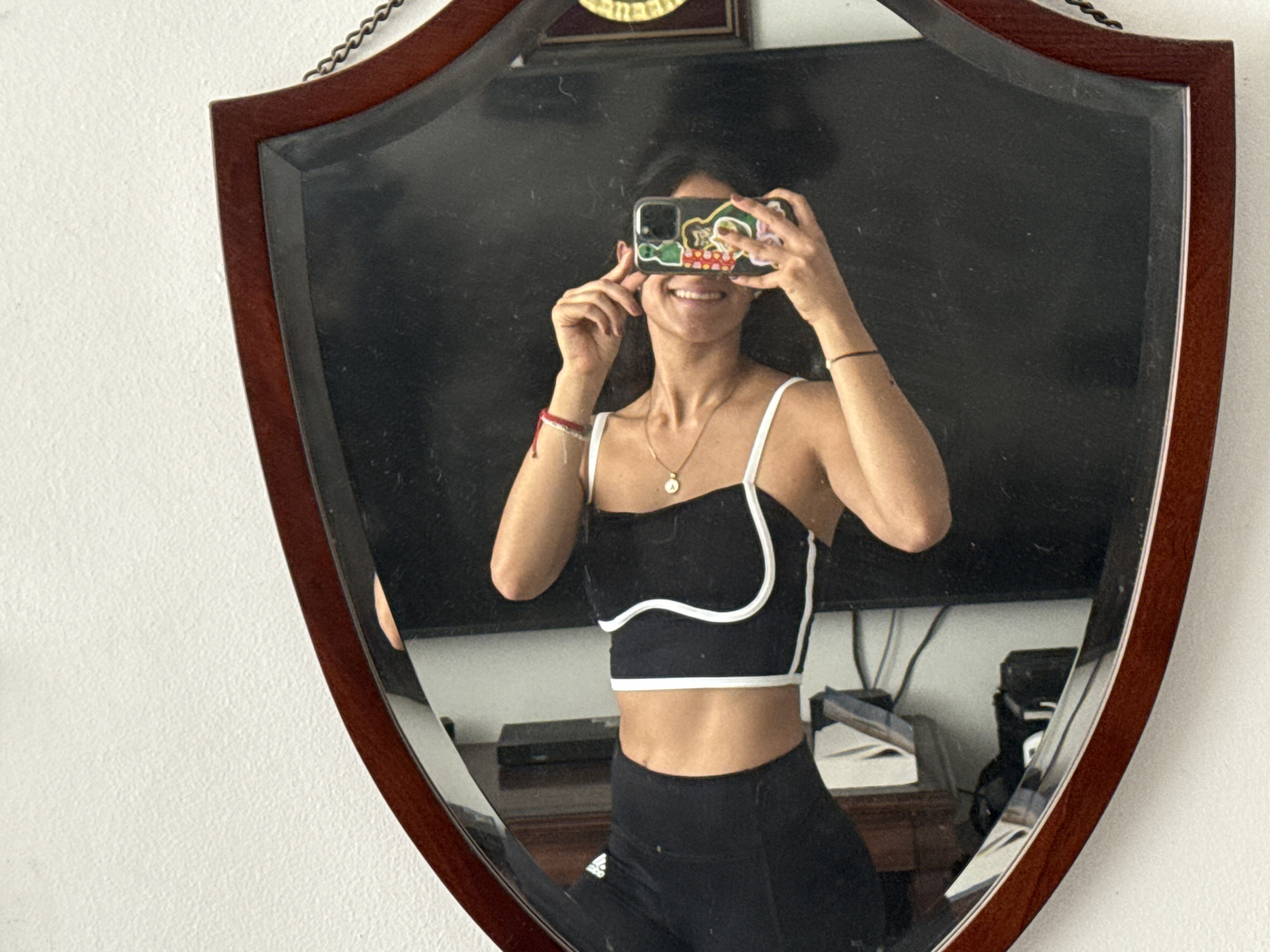 Woman takes mirror selfies with cats in Puebla apartment