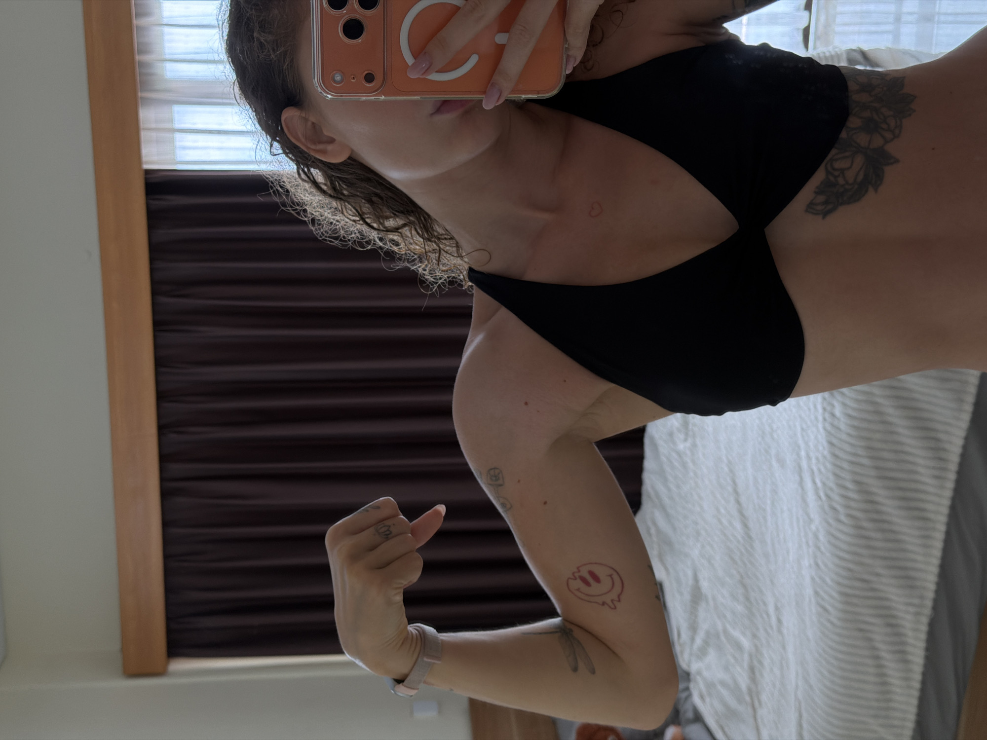 Woman takes multiple mirror selfies in North Kuta bedroom