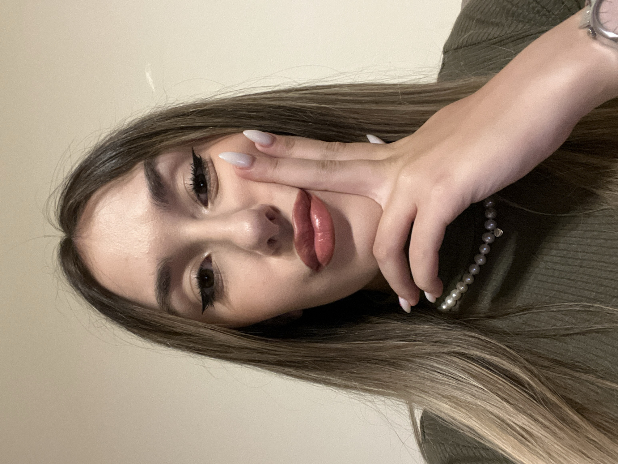 Woman takes indoor selfie portraits in Sofia, Bulgaria