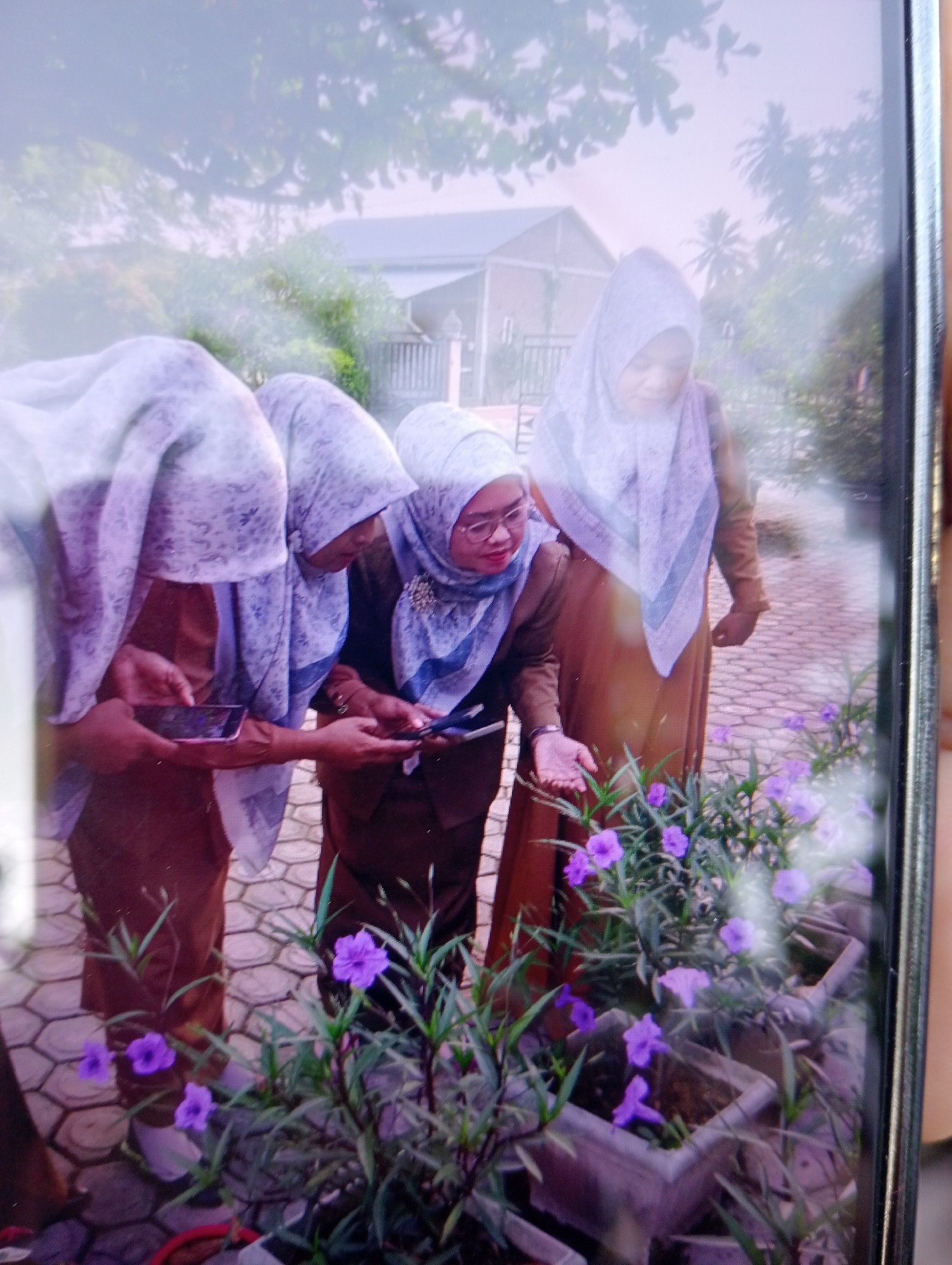 Indonesian school campus life alongside colorful garden plantings