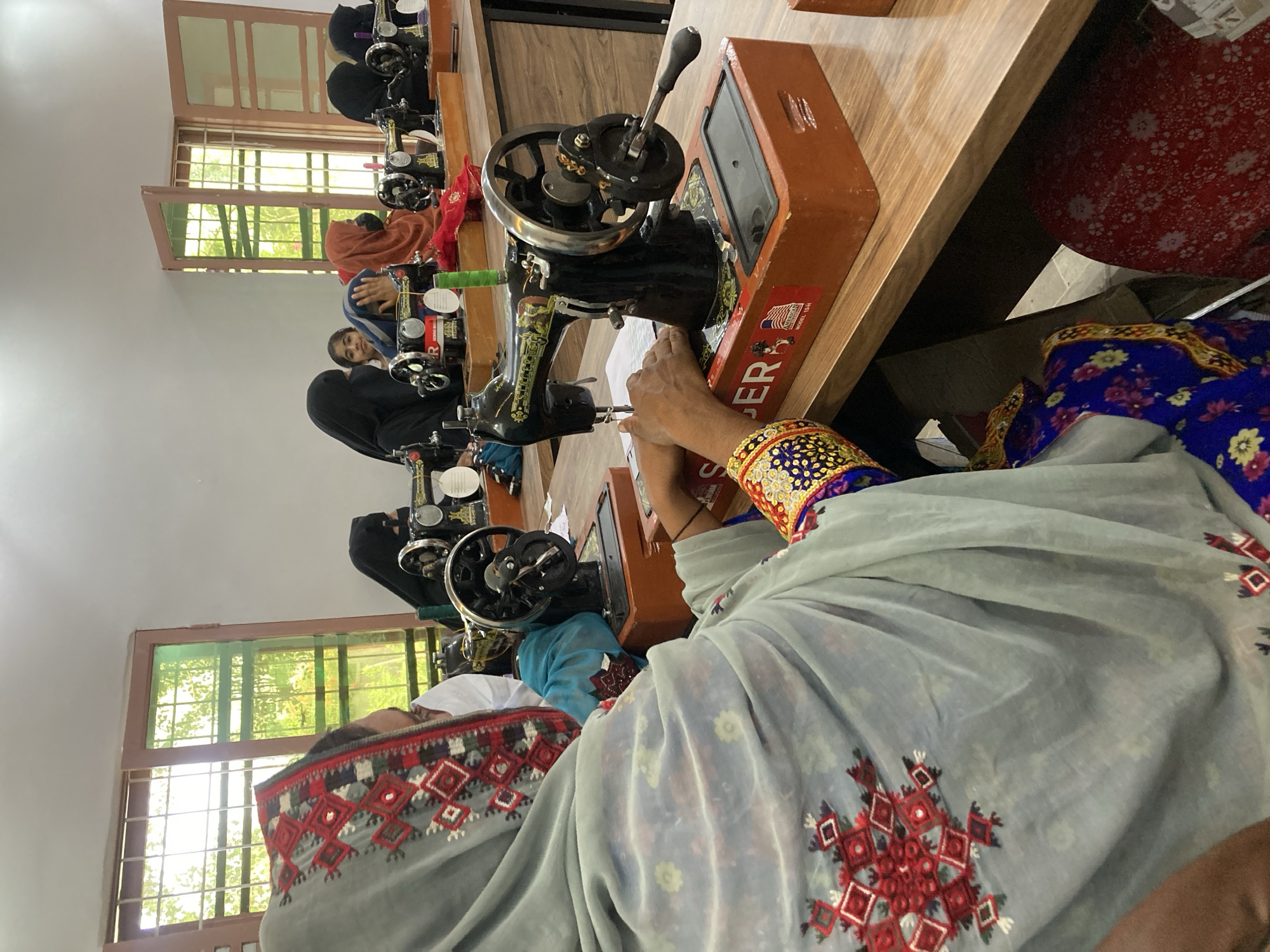 Women attend sewing training session in Rāwāni, Pakistan