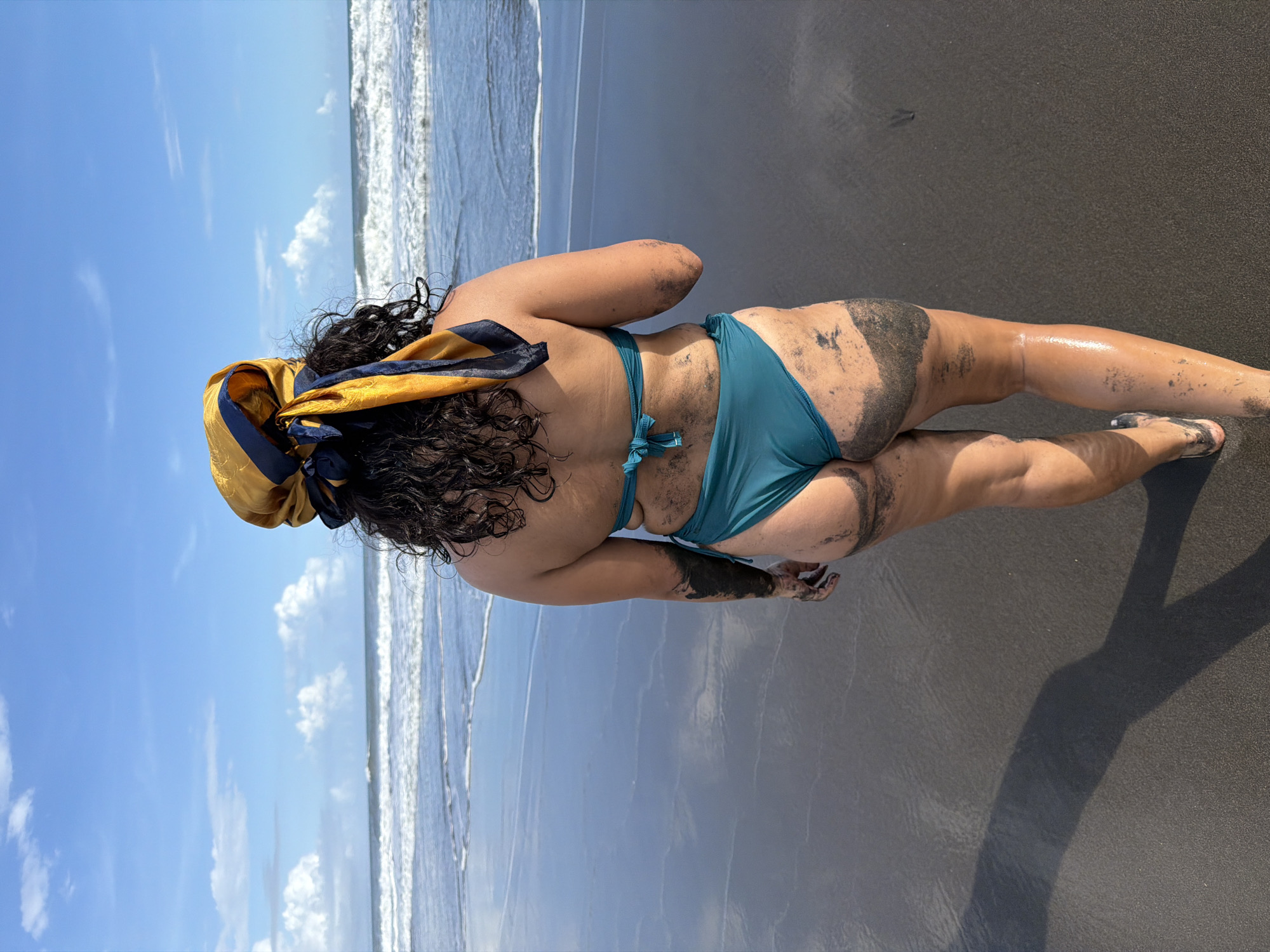 Woman enjoys sunny morning at Indonesian volcanic beach