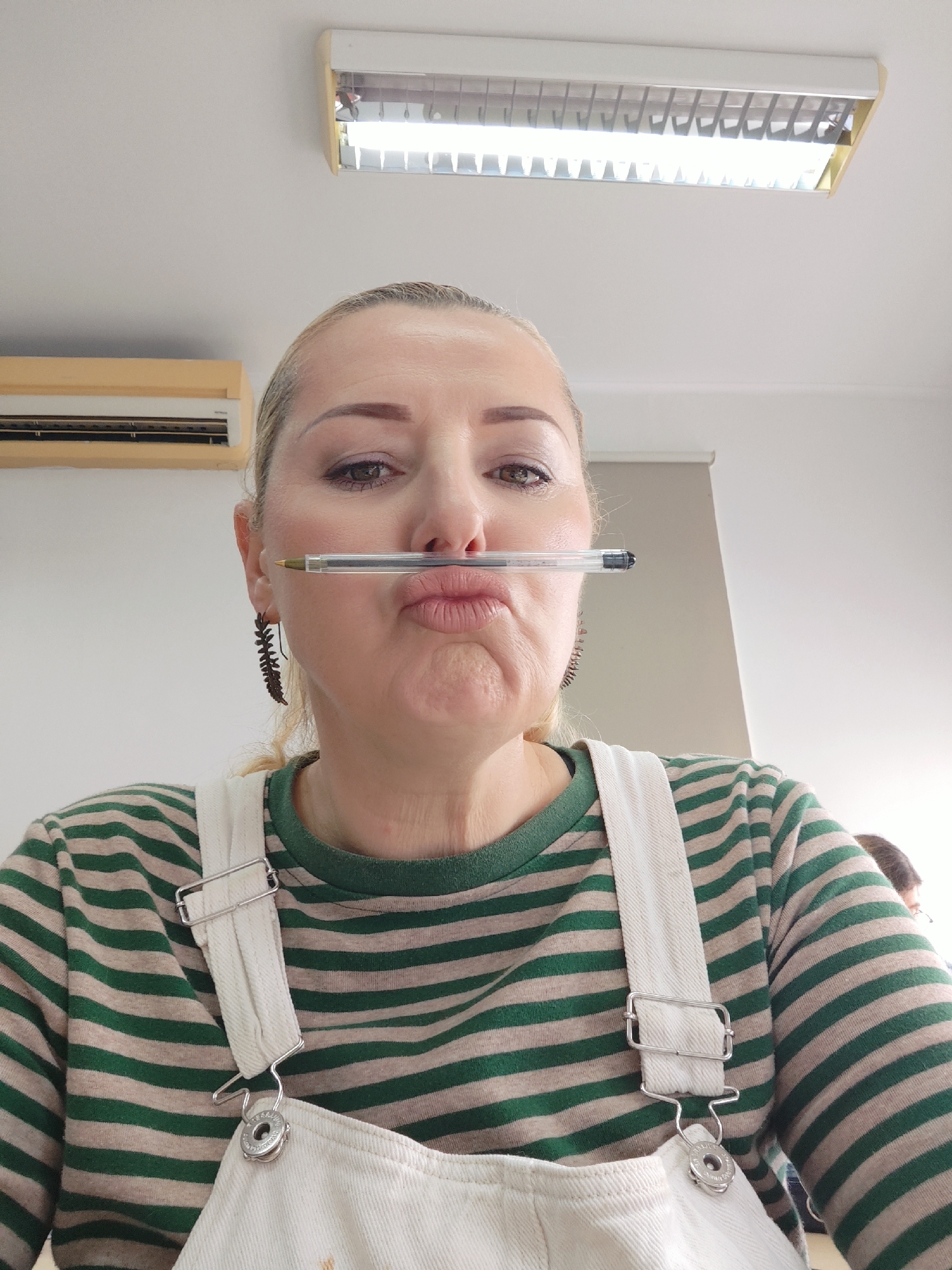Woman performs pen-balancing trick in Ponta Delgada