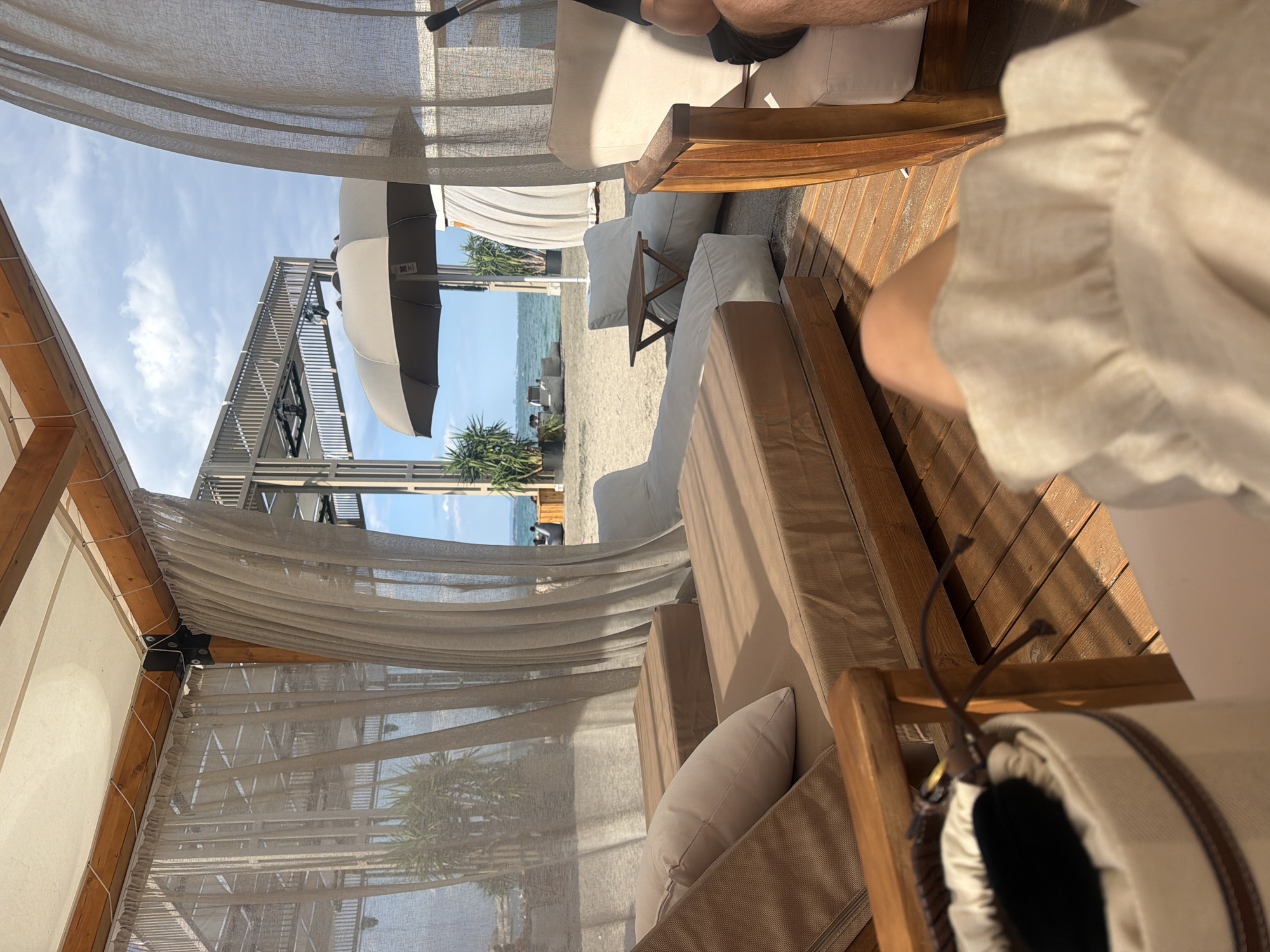 Chilling at a beach club cabana on a sunny afternoon