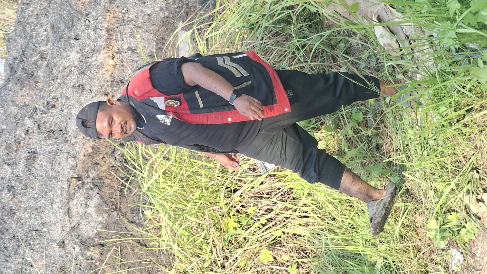 Lhokseumawe fire crews tackle a brush fire on scorched ground