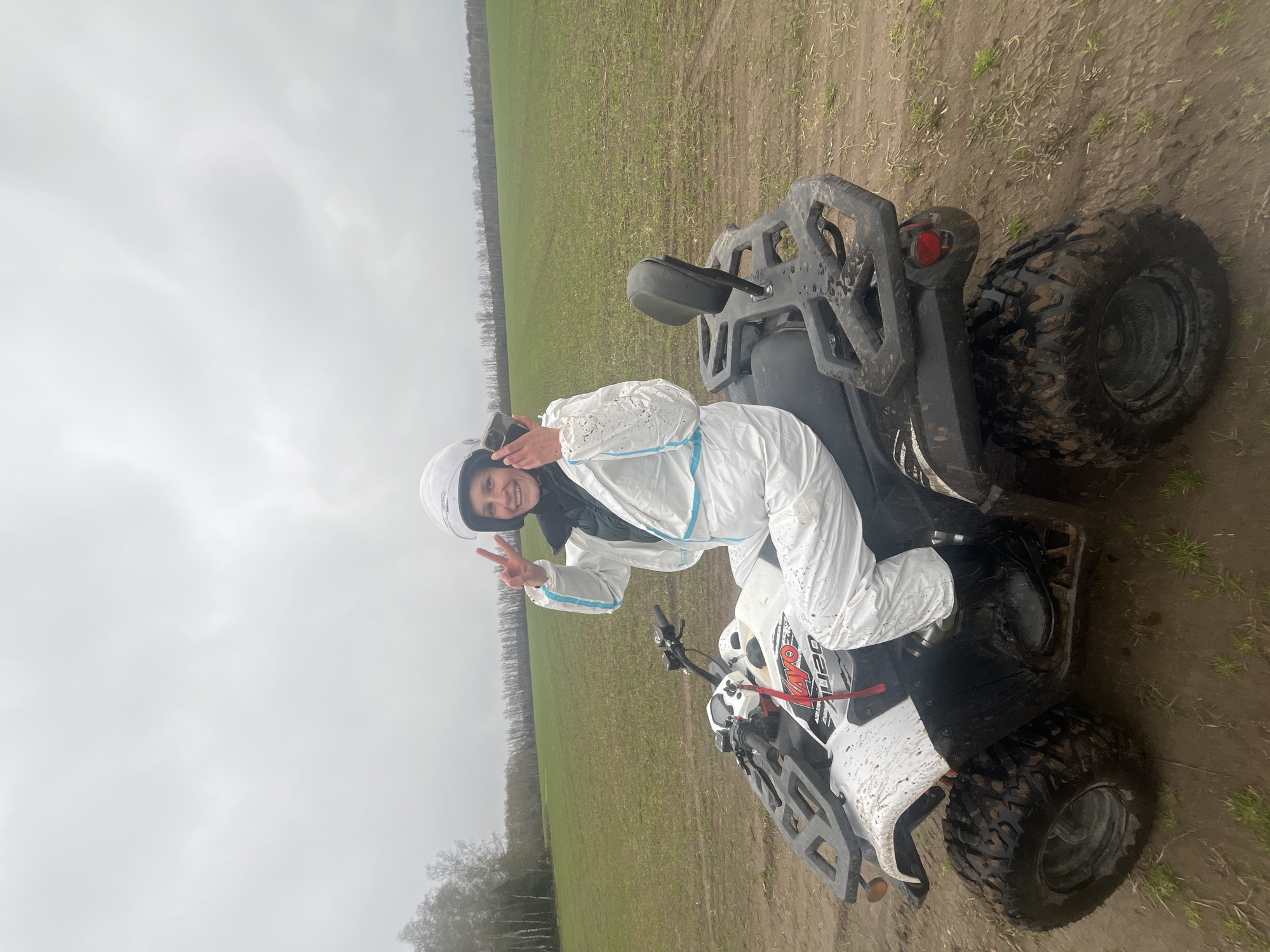 ATV riders navigate muddy terrain in Russian countryside