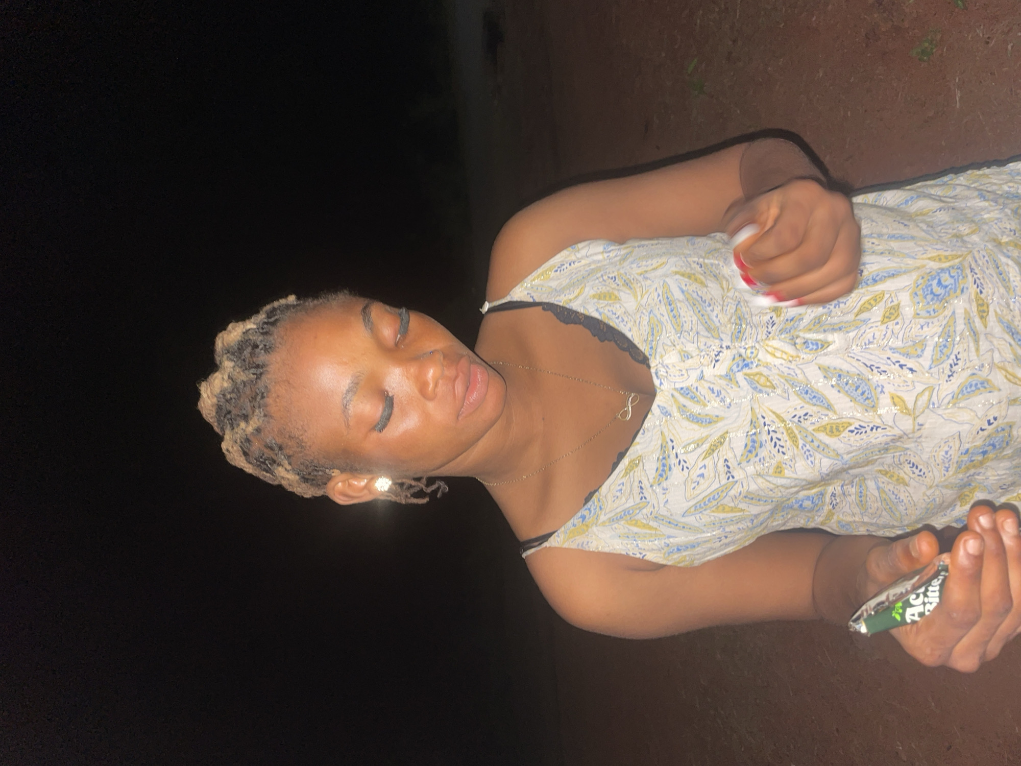 Evening gatherings documented in dimly lit Ogbe, Nigeria
