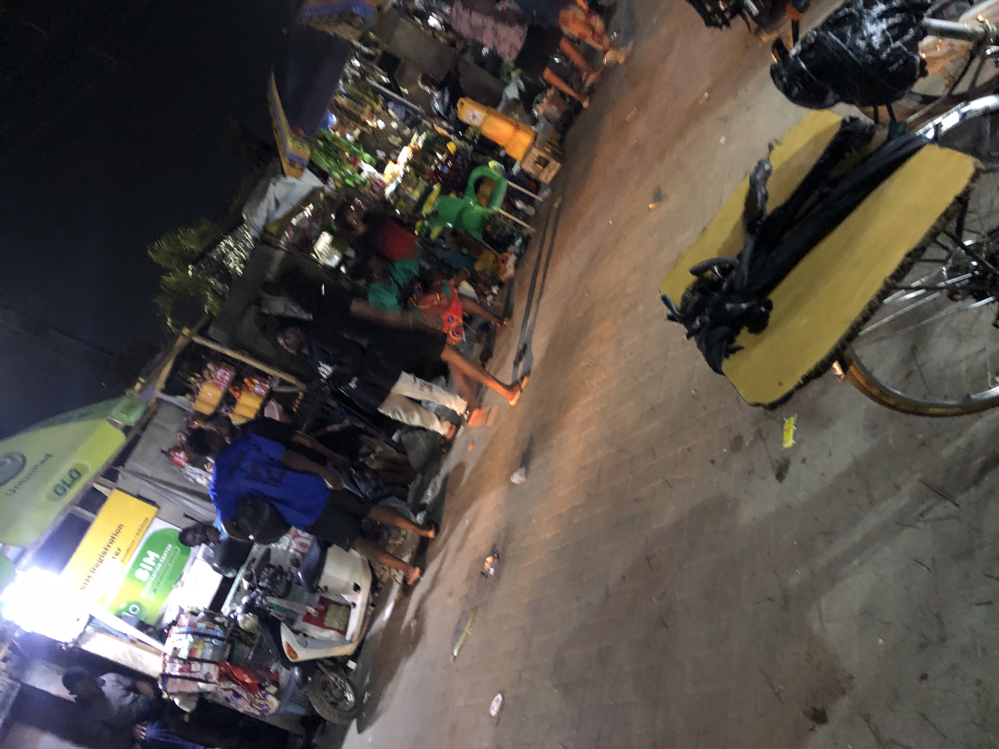 Evening street life documented in Moba, Nigeria commercial district