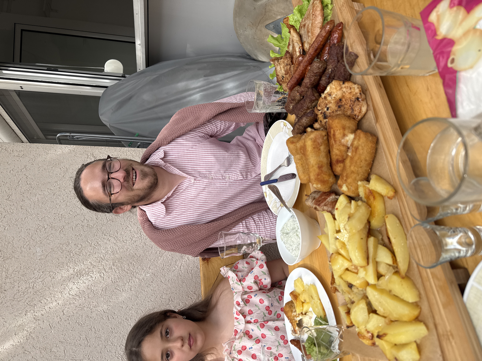 Family meal enjoyed at coastal restaurant in Montenegro
