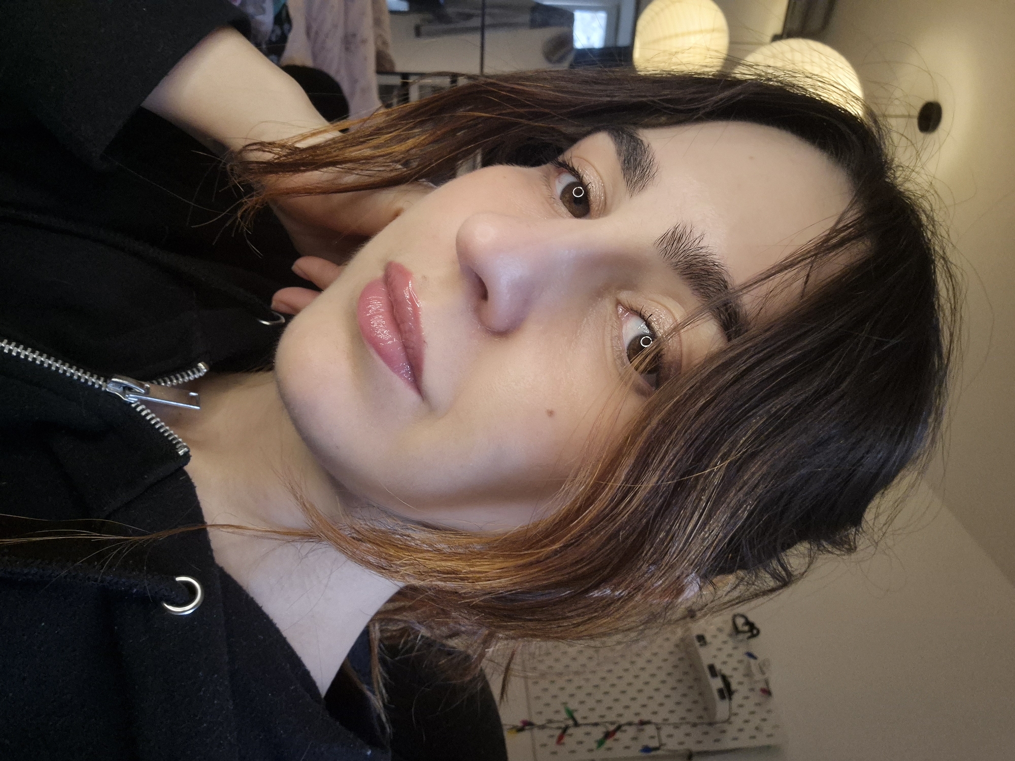 Woman takes beauty selfies indoors in Strasbourg
