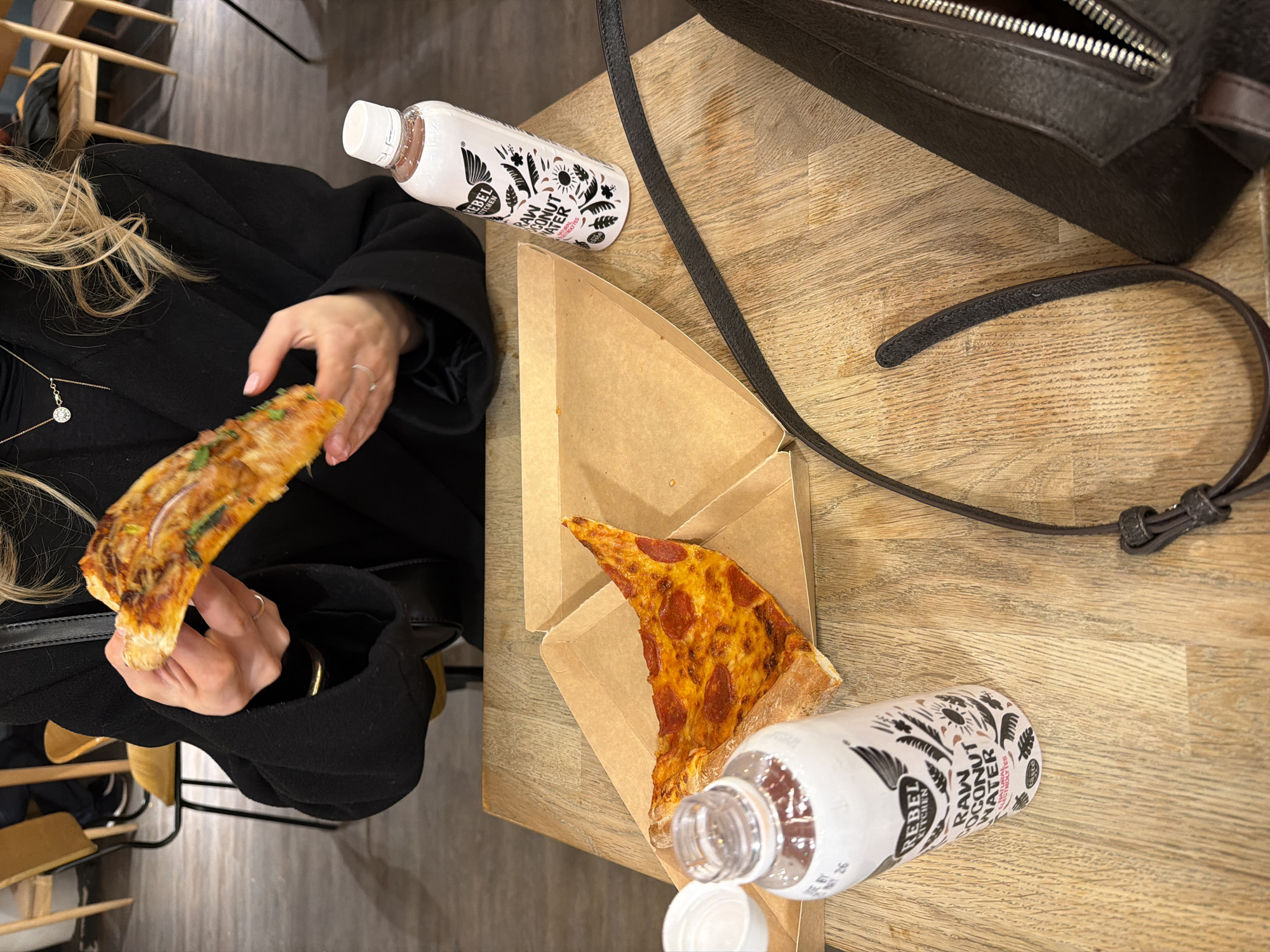 Woman enjoys pizza dinner in London