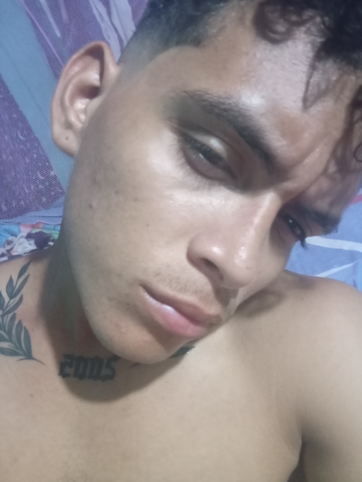 Tattooed young man photographed in Altagracia, Venezuela